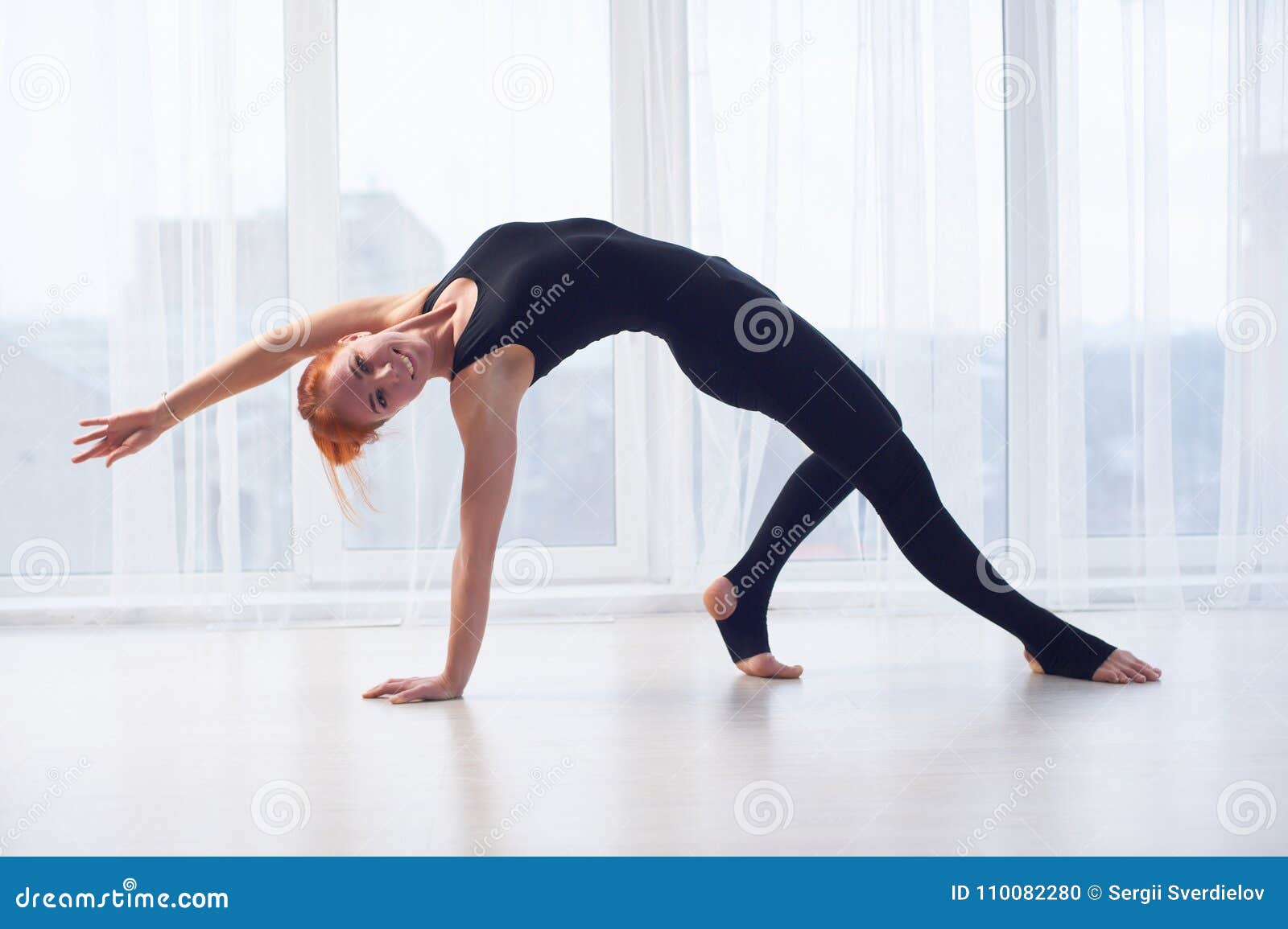 Woman doing Wild Thing yoga pose outdoors. Female practicing