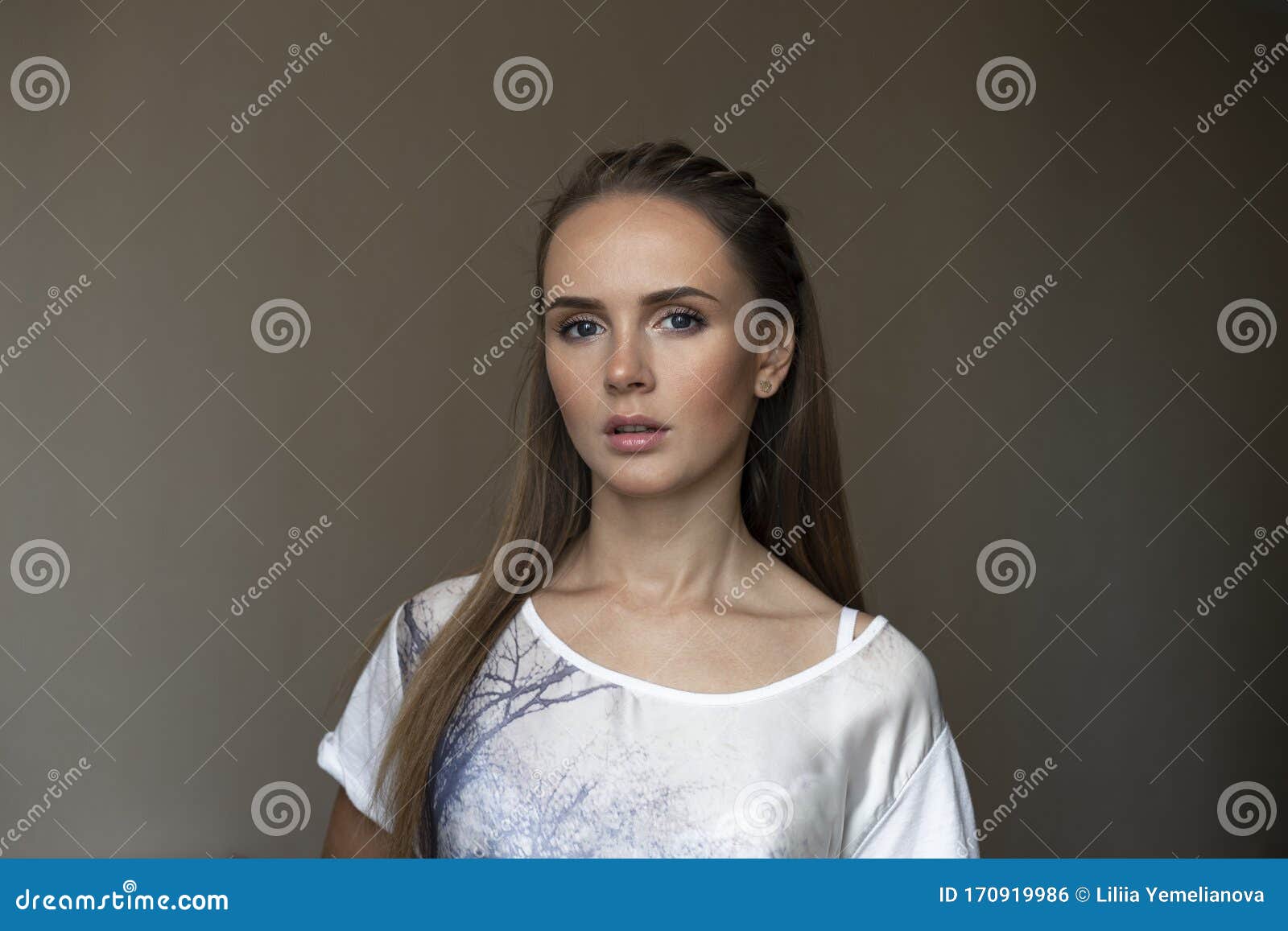 Beautiful Young Adult Woman with Strange Expression on Her Face pic