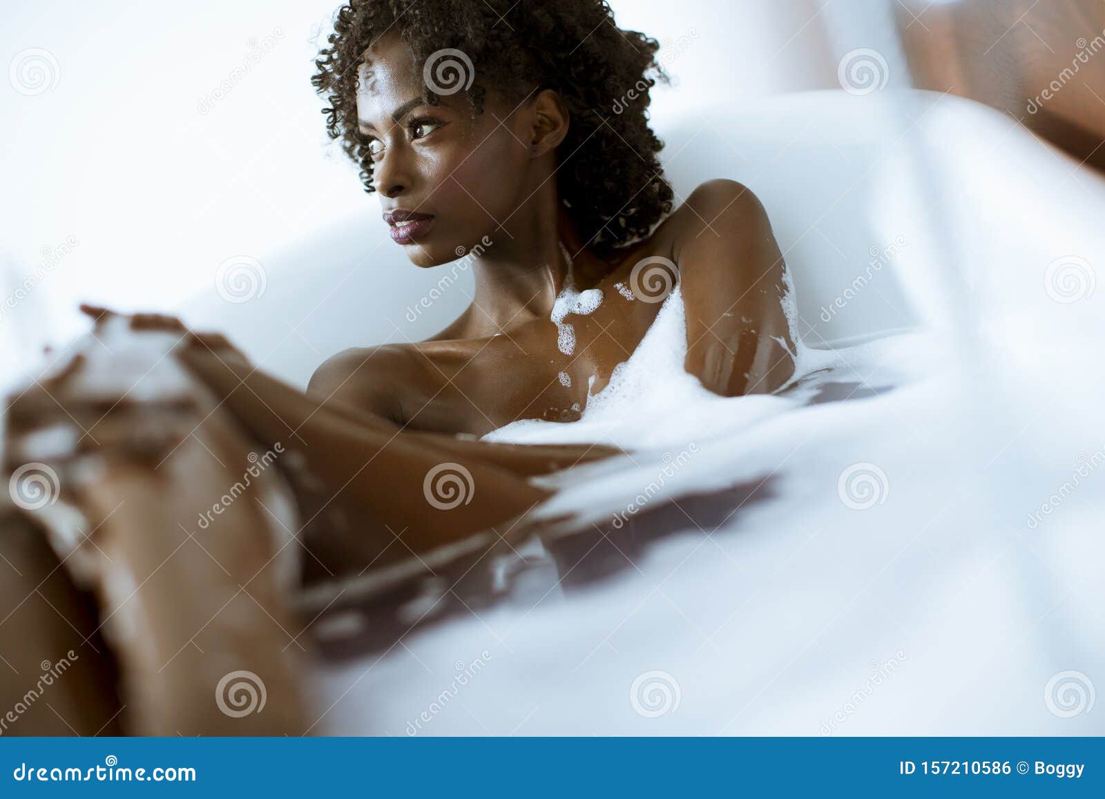 Beautiful African American Woman Bathing In A Tub Full