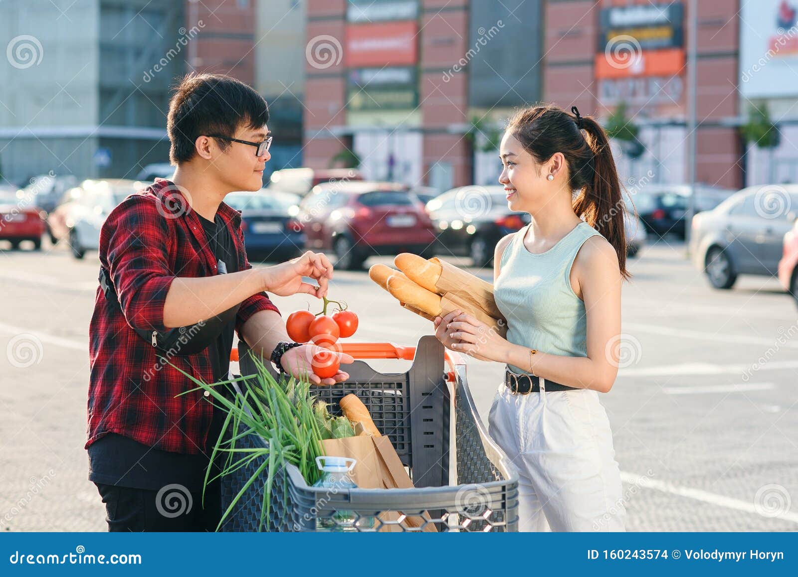 Beautiful Young Asian Couple Checking Purchased Food In ...