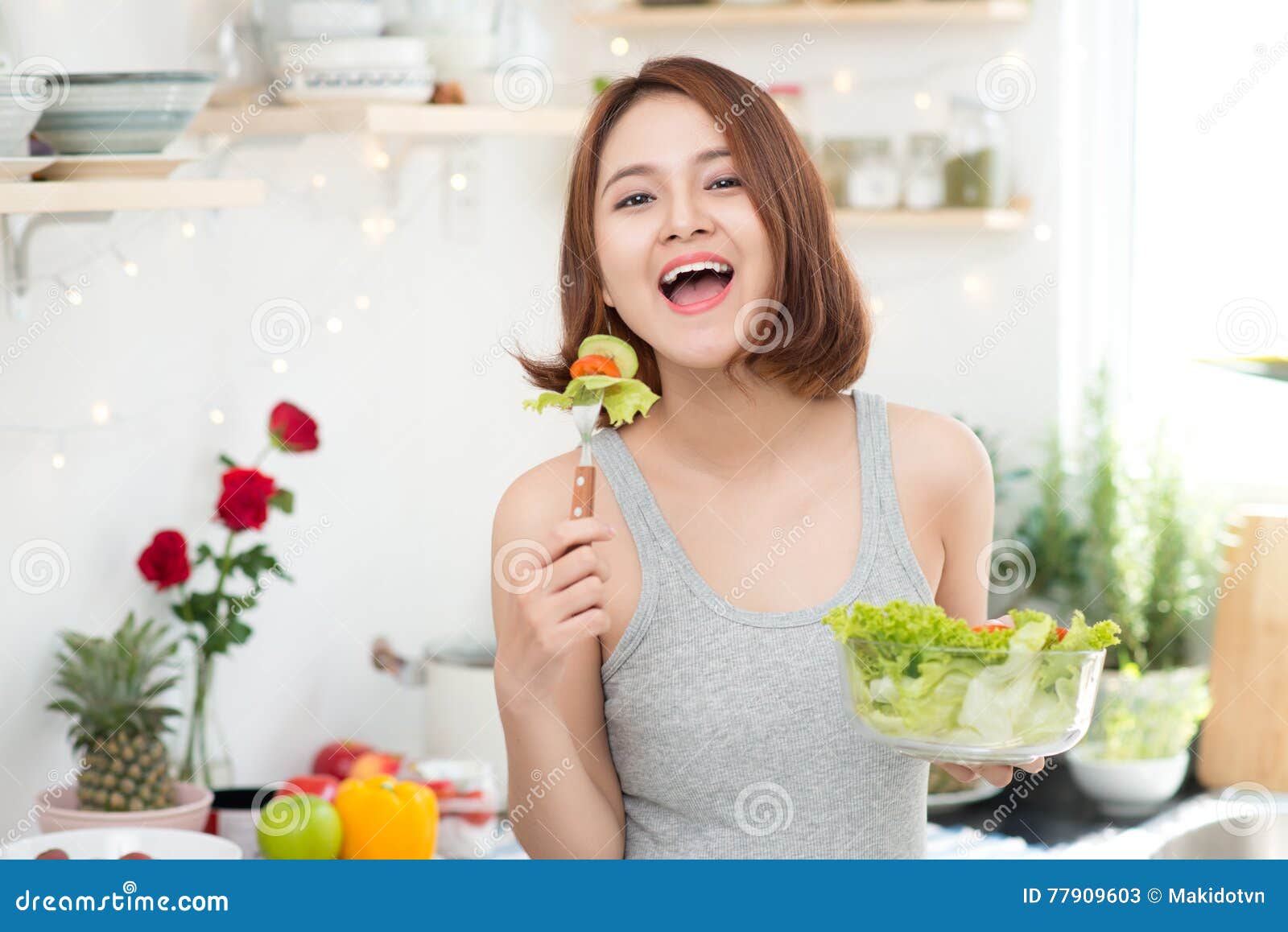 Beautiful Young Asian Girl Eating Salad picture