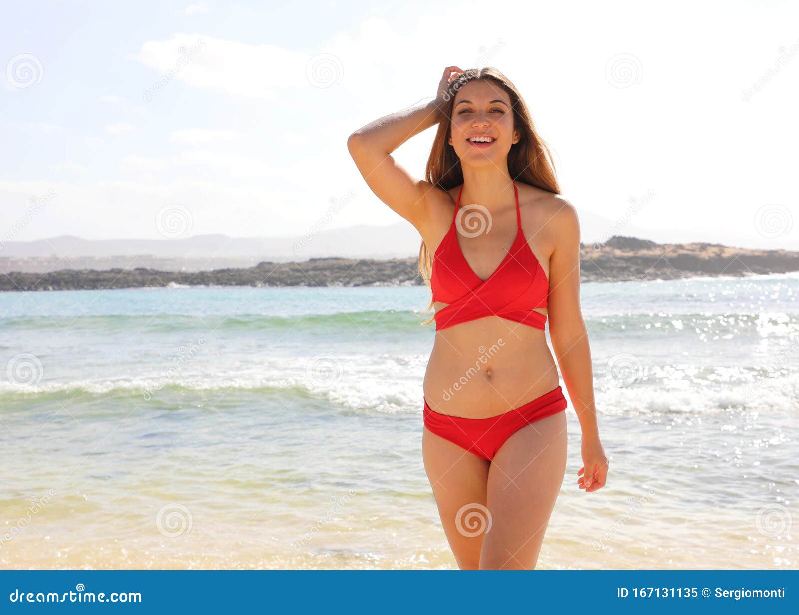 Beautiful Young Bikini Woman Standing at Sea Beach in Fuerteventura, Canary Islands