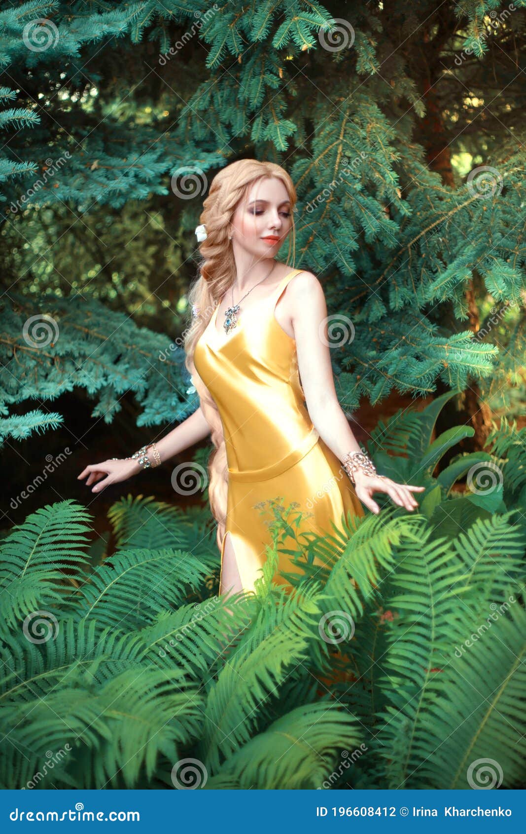 beautiful young blond woman with very long hair that is braided. the girl is dressed in a seductive yellow dress