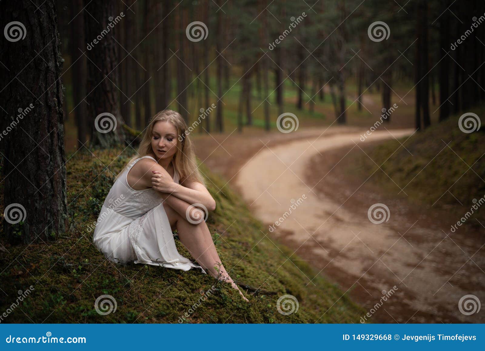Beautiful Young Blonde Woman Sitting In Forest Nymph In White Dress In 5347
