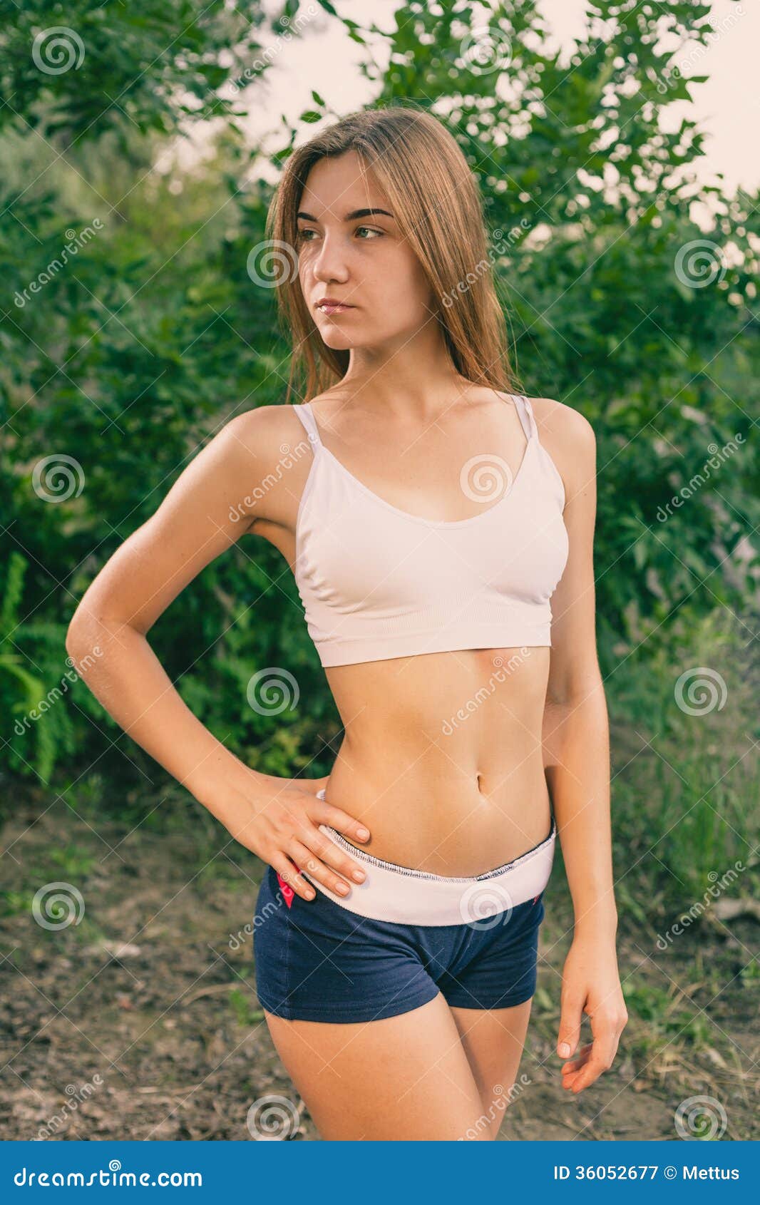 Beautiful Young Blonde Woman In White Tank Top And Stock Image.