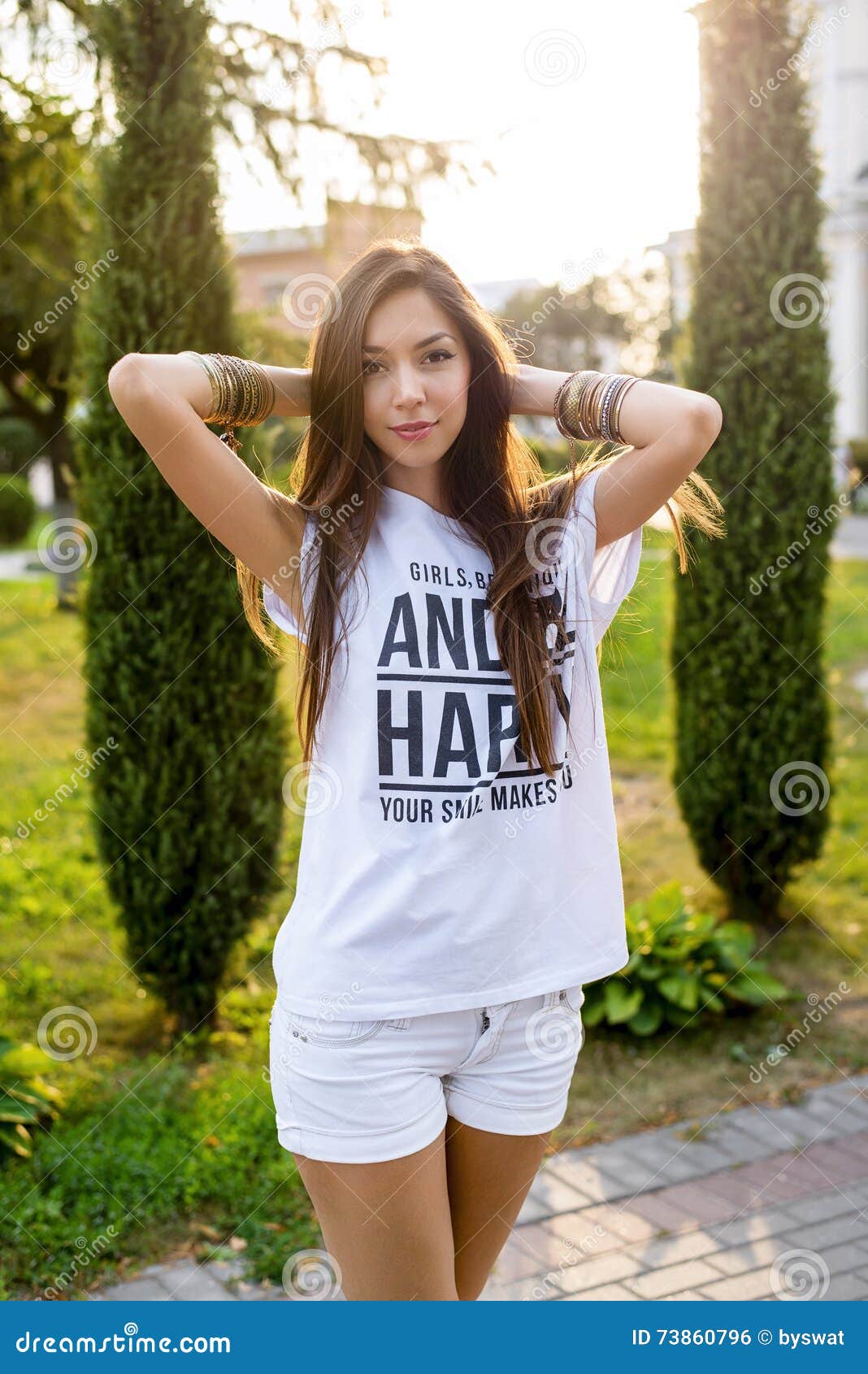 Beautiful Young Brunette Girl Posing in a City Sunny Summer Day, in ...