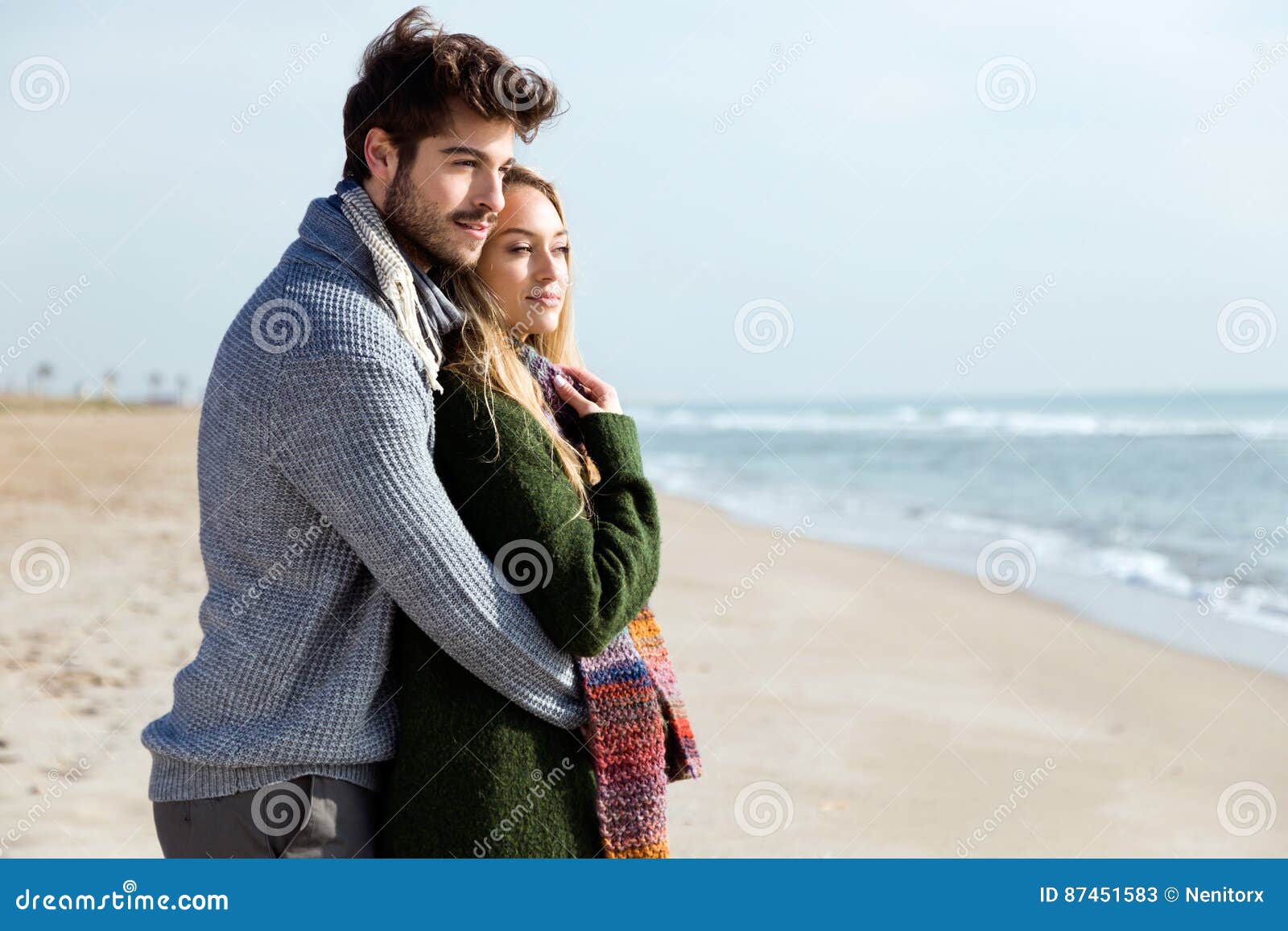 Cold Marriage And Passionate Love Beautiful Young Couple in Love in a Cold Winter on the Beach. Stock