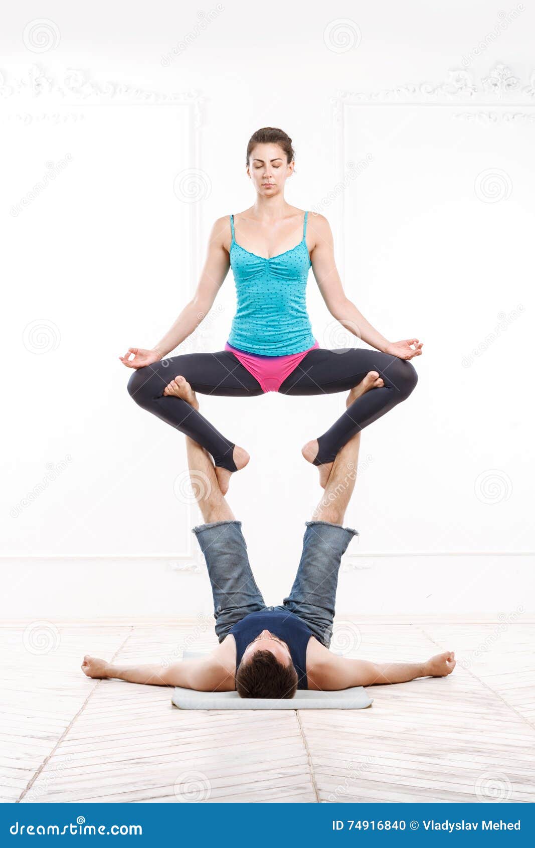 Acrobatic yoga in a gym stock image. Image of space, acrobatic - 57205871