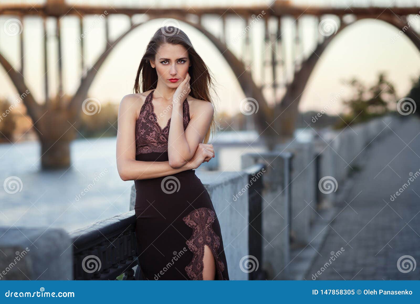 Beautiful Young Fashionable Woman Posing in Dress at the River Coast in ...