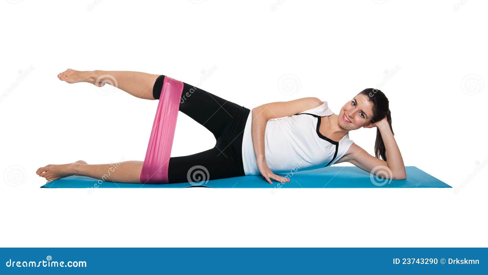 beautiful young female exercising on a blue matt