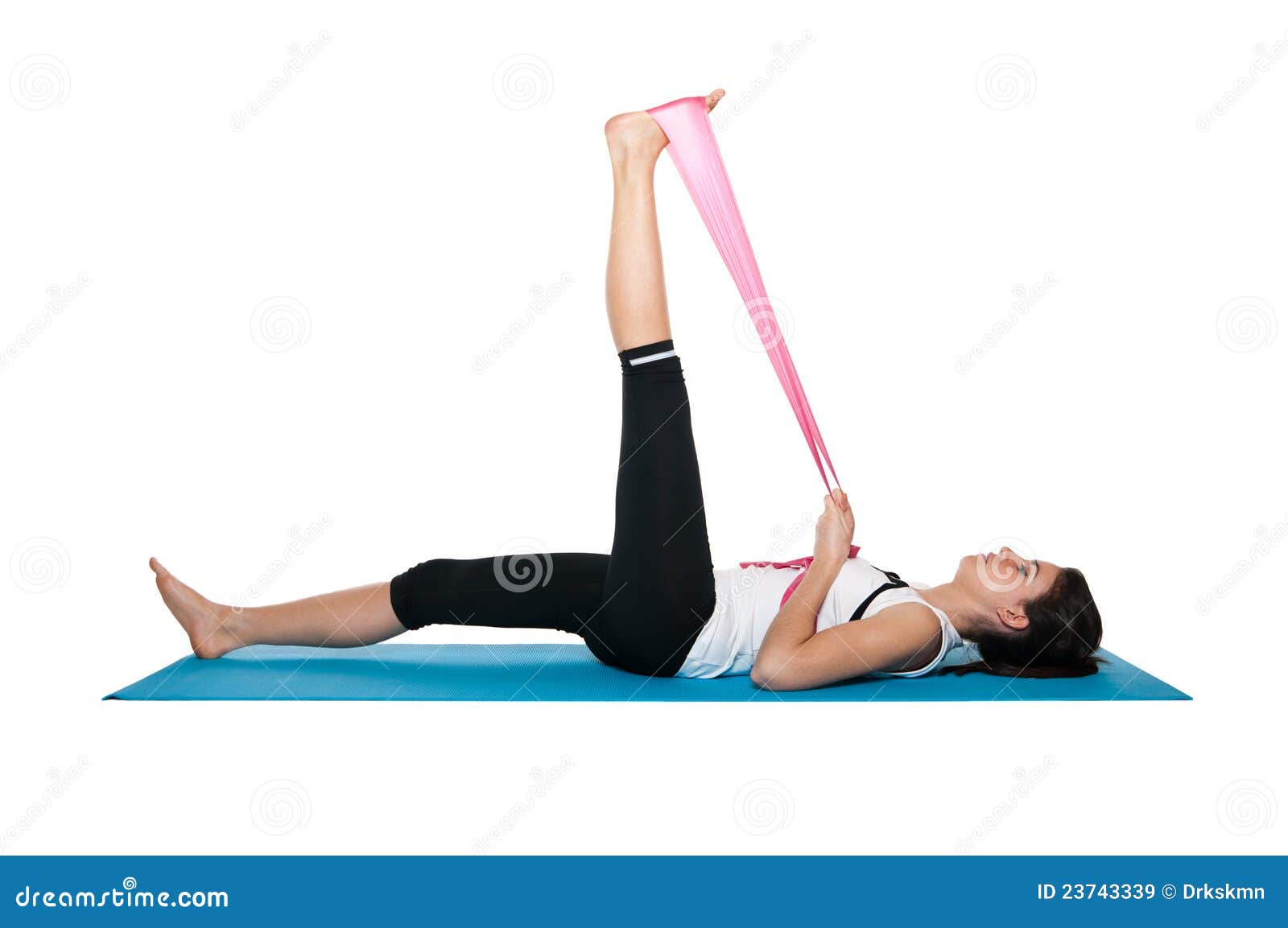 beautiful young female exercising on a blue matt