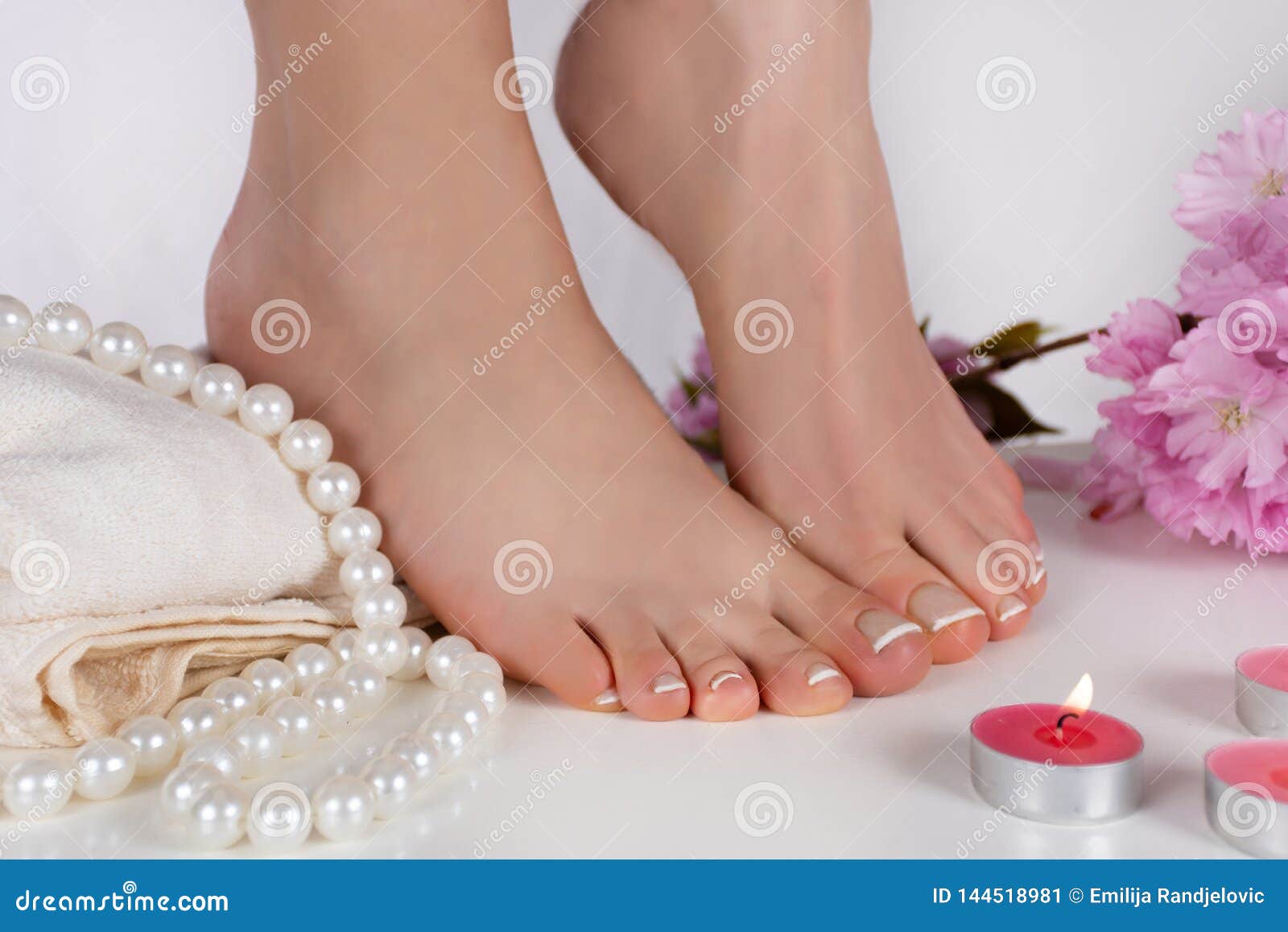 Legal Teens Feet - Girl Bare Feet with French Pedicure on White Towel and Decoration Candle,  Pearls and Pink Flower. Feet Fetish Concept Stock Image - Image of health,  french: 144518981