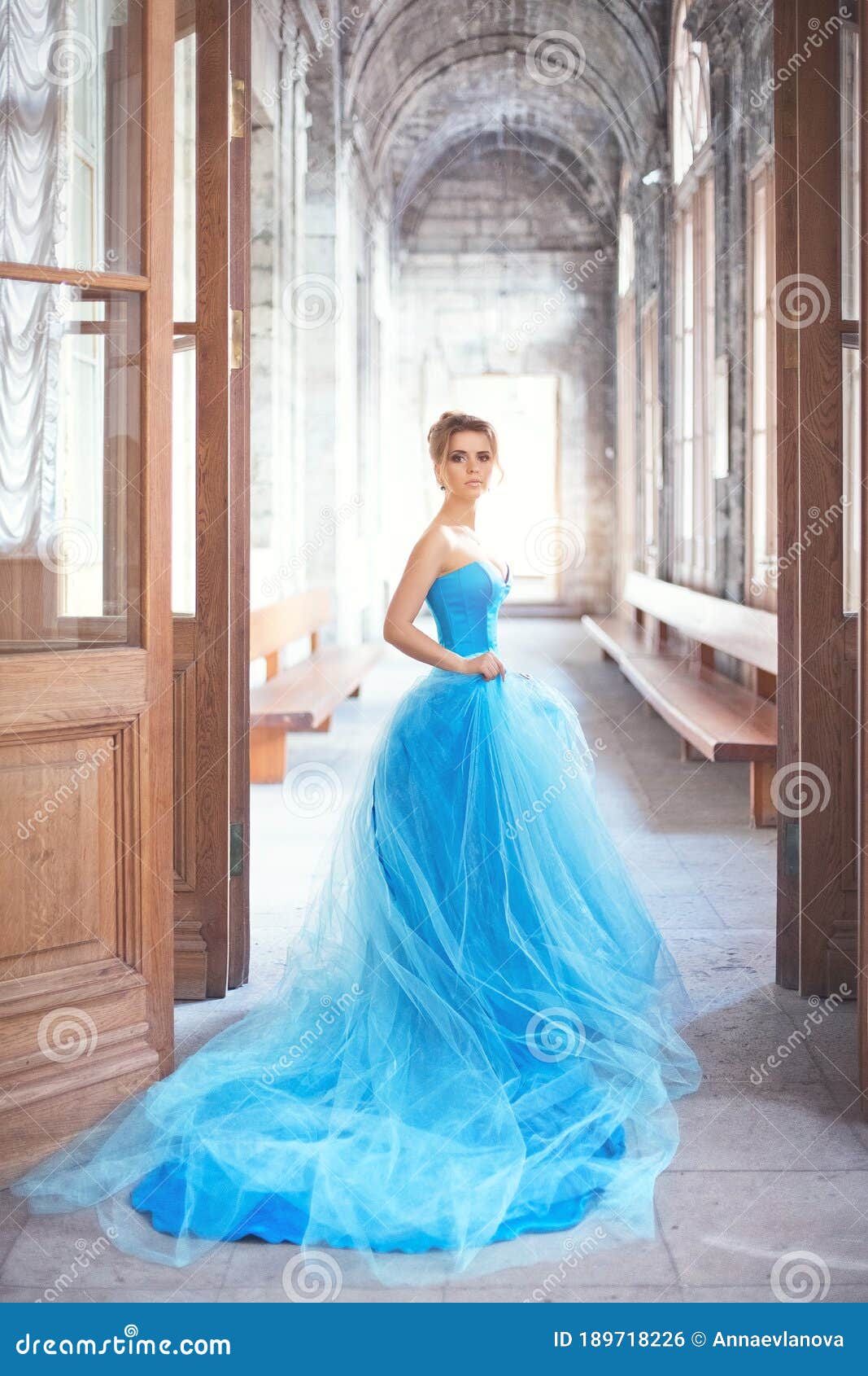 A Beautiful Young Girl in a Blue Ball Dress Stock Photo - Image of ...