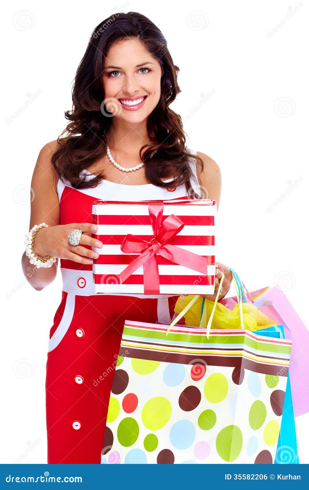 Beautiful young girl with a Christmas present. Beautiful young Christmas girl with a present isolated on white background.