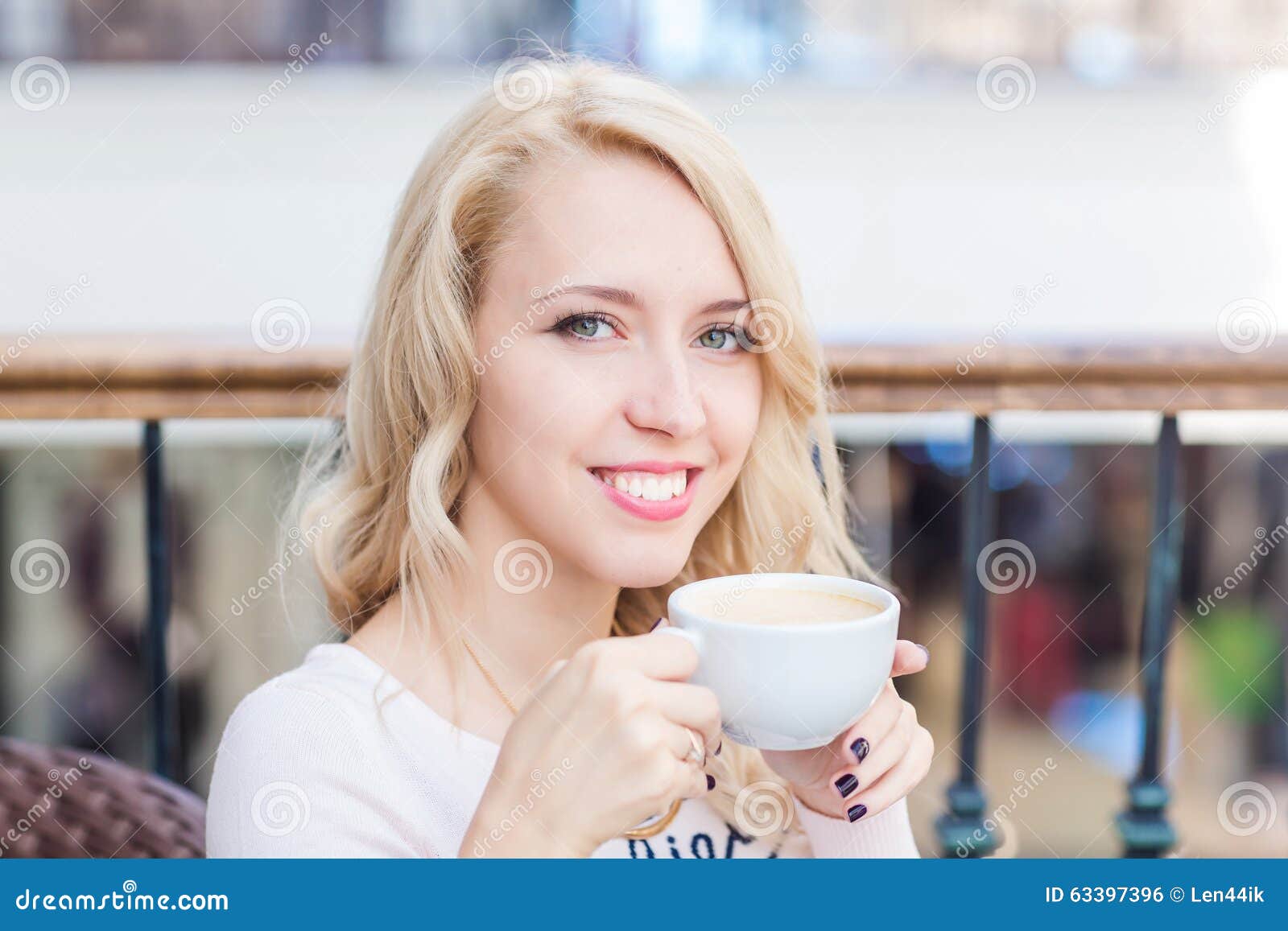 Beautiful Young Girl Drinking Coffe in a Restaurant. Stock Photo ...
