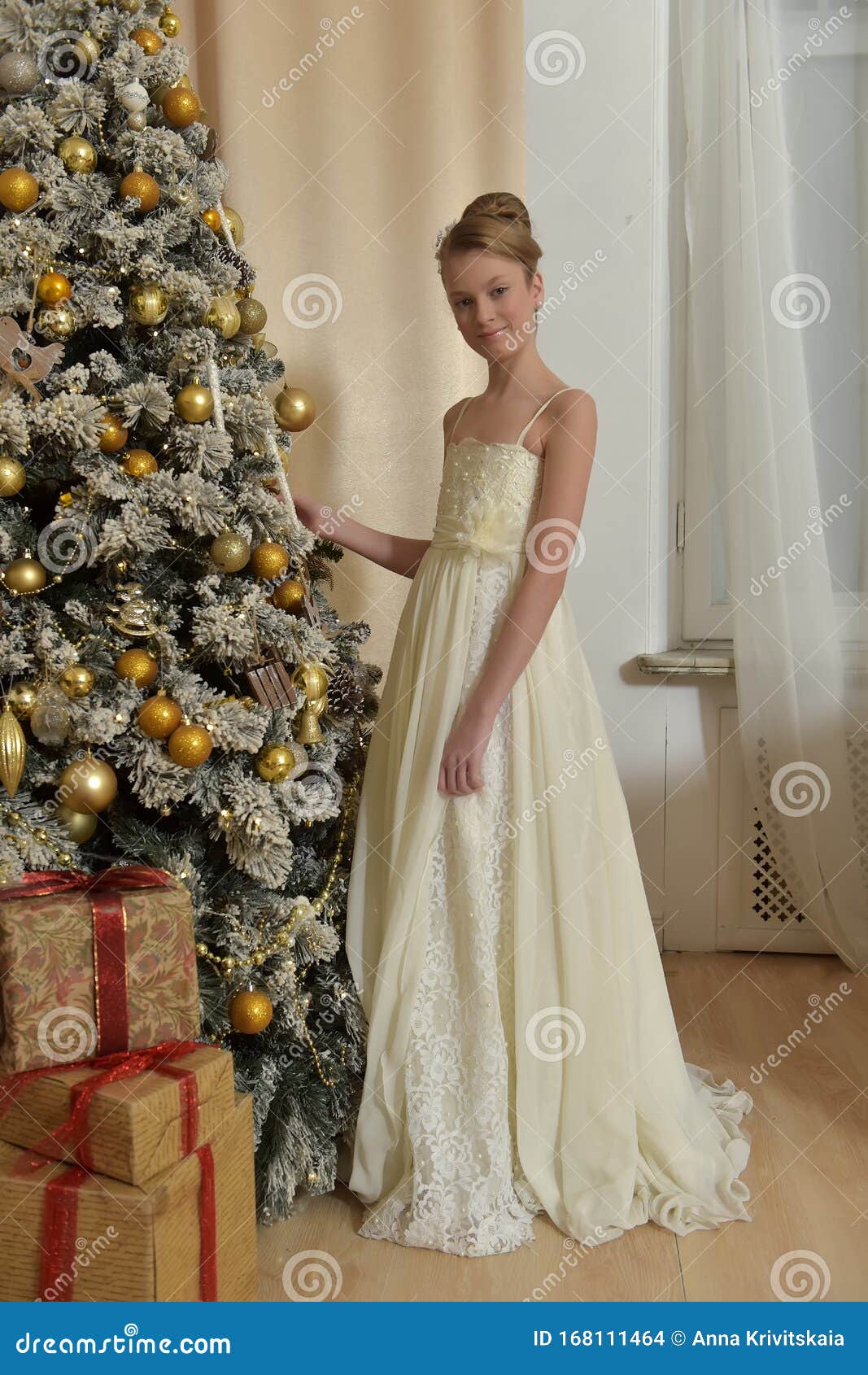 Beautiful Young Girl with Evening Hairstyle in a White Dress by the  Christmas Tree Stock Photo - Image of fashion, female: 168111464