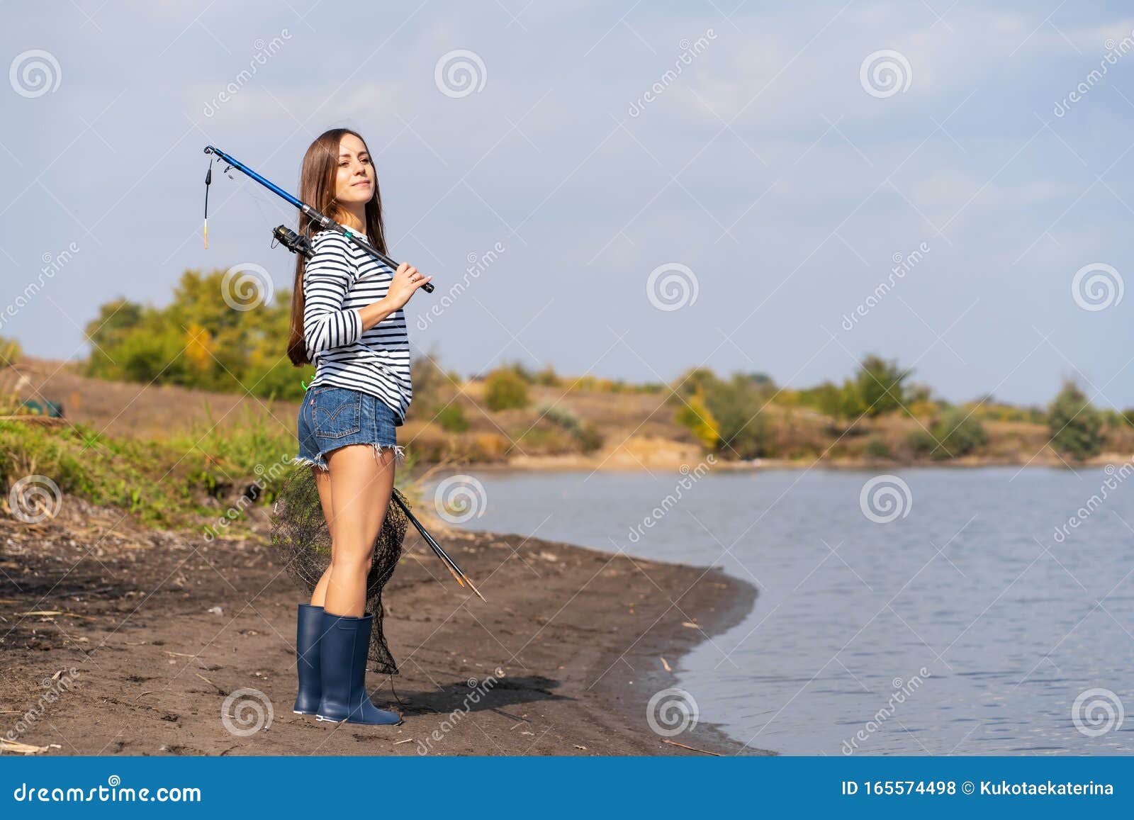 A Beautiful Young Girl Goes Fishing. a Girl with a Fishing Rod and a Cage  in Hand is Walking Along the Lake Stock Photo - Image of positive, adult:  165574498