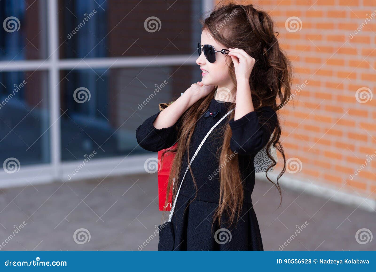 Beautiful Young Girl with a Lot of Packages at the Outlet of the Stock ...