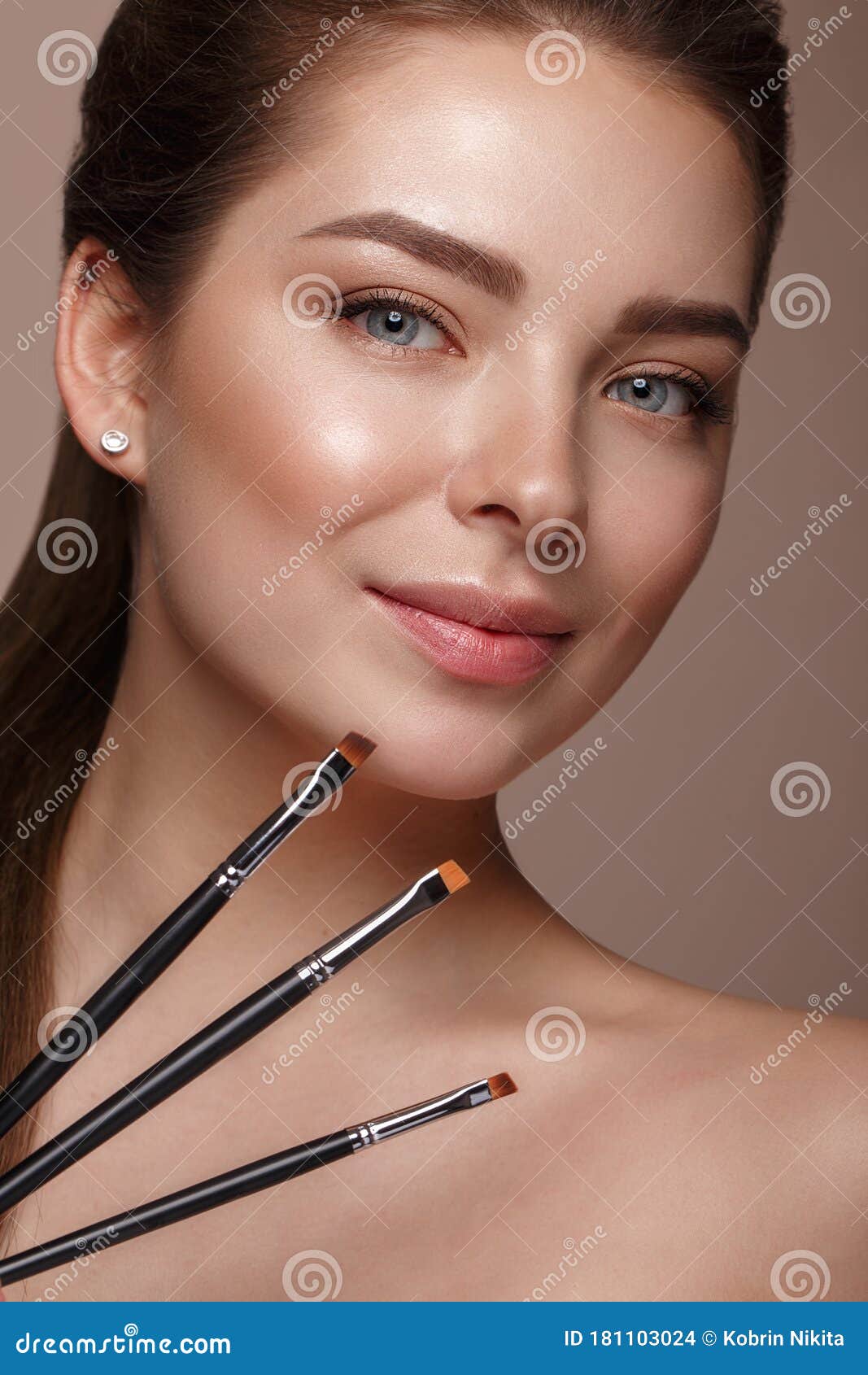 Beautiful Young Girl With Natural Nude Make Up With Cosmetic Tools In 