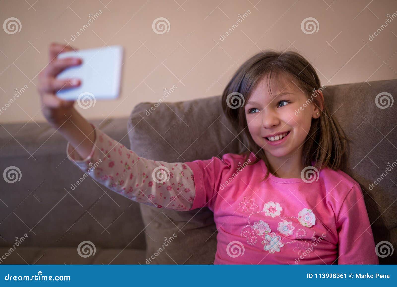 Beautiful Young Girl Taking a Selfie on the Couch Stock Image - Image ...