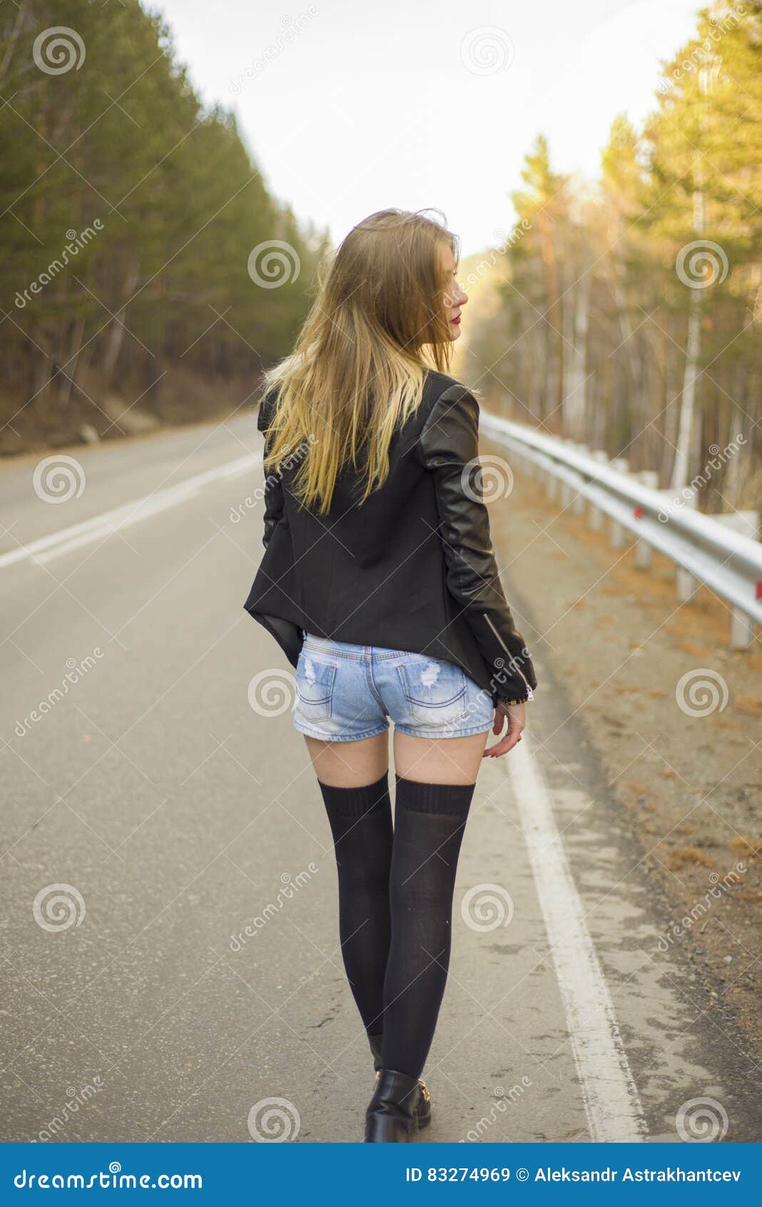 Beautiful Young Girl Walking Down the Road in the Forest. Stock Image ...