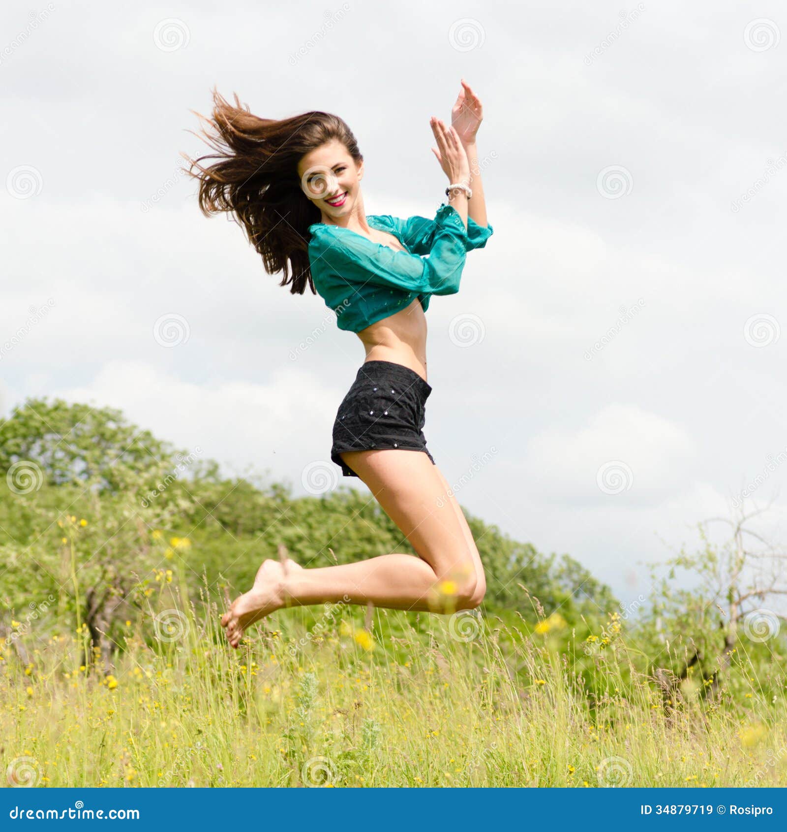 beautiful-young-happy-woman-dancing-jumping-outdoors-summer-day-smiling-looking-camera-girl-high-background-34879719.jpg