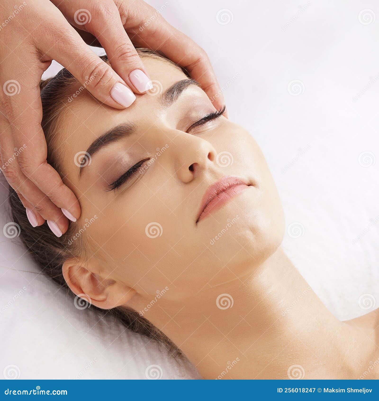 Beautiful Young And Healthy Woman Having Face Massage In Spa Salon Hands Of Professinal