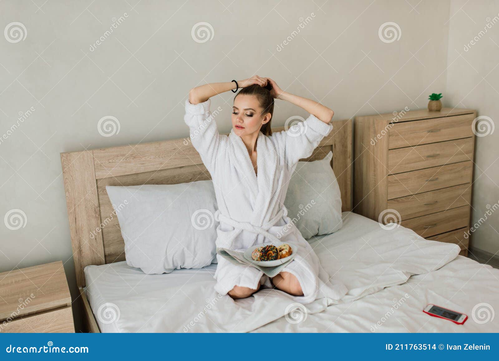 beautiful young healthy woman relaxing in a robe, hotes, room, spa salon