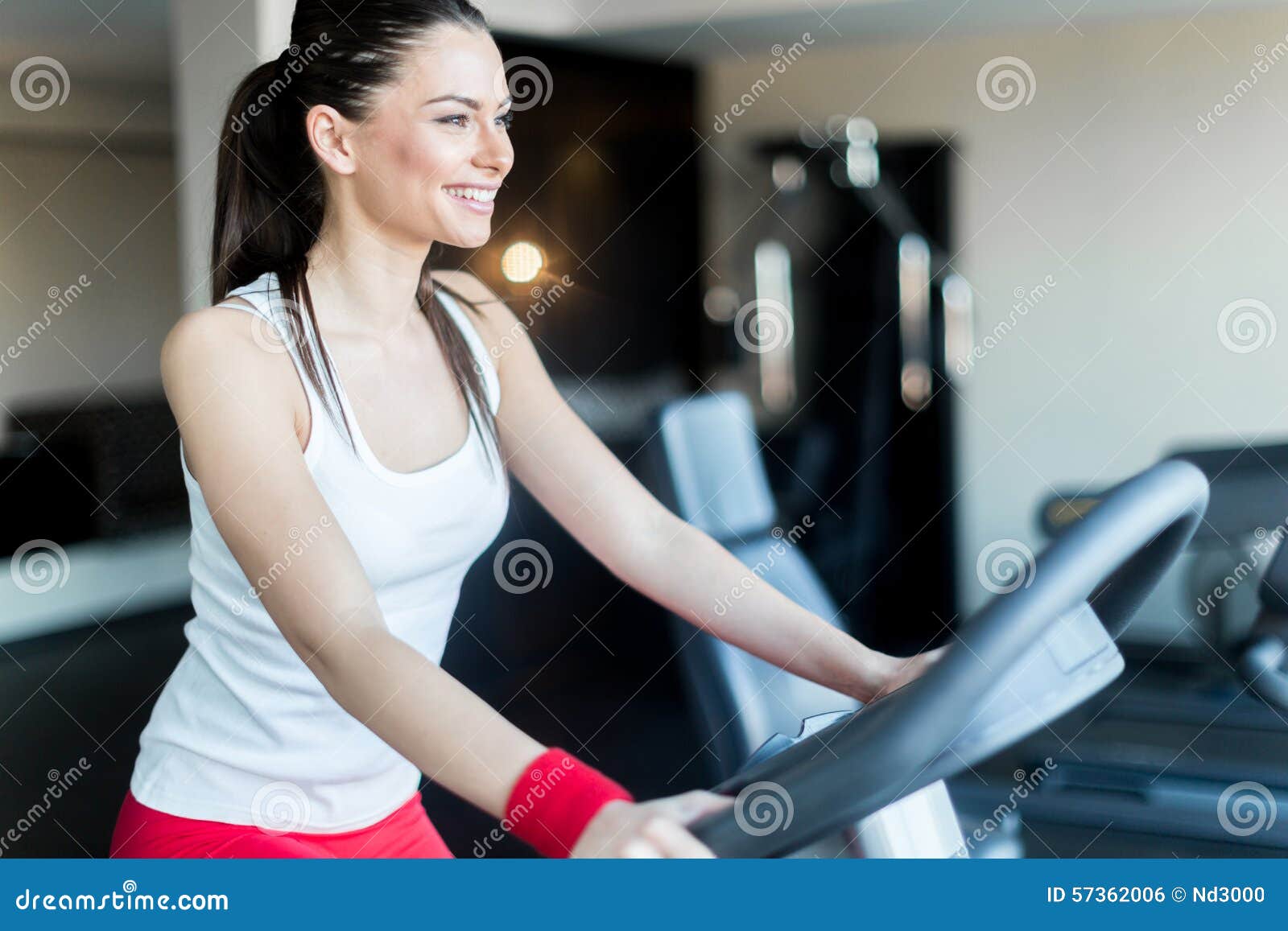 Beautiful, Young Lady Riding the Bicycle in a Gym Stock Photo - Image ...