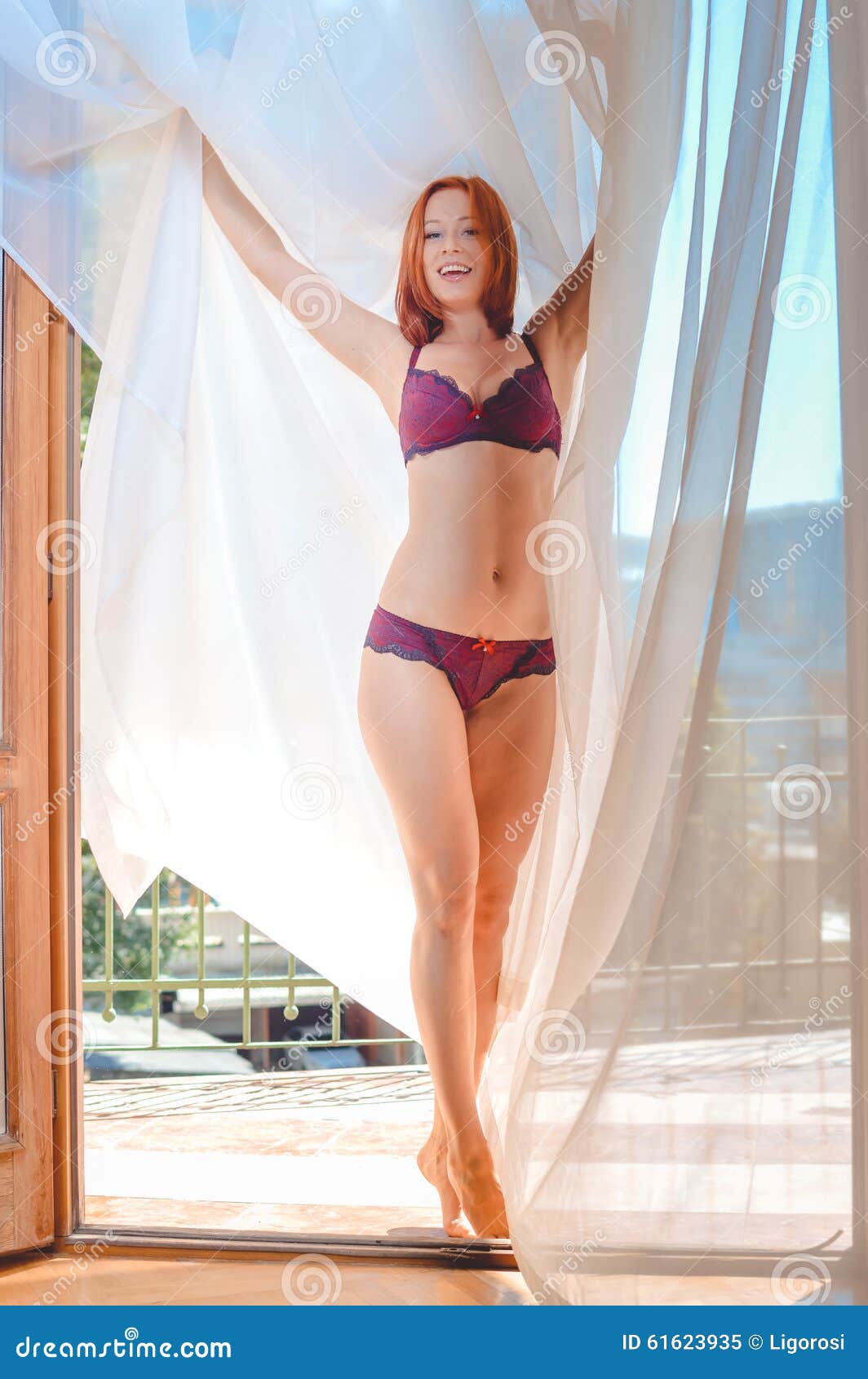 Beautiful Young Lady Standing in Red Lingerie Near Stock Image