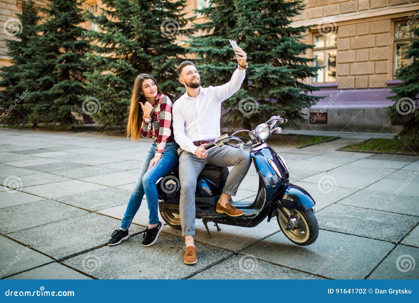 Beautiful Young Loving Couple Sitting on Scooter Together and Making ...
