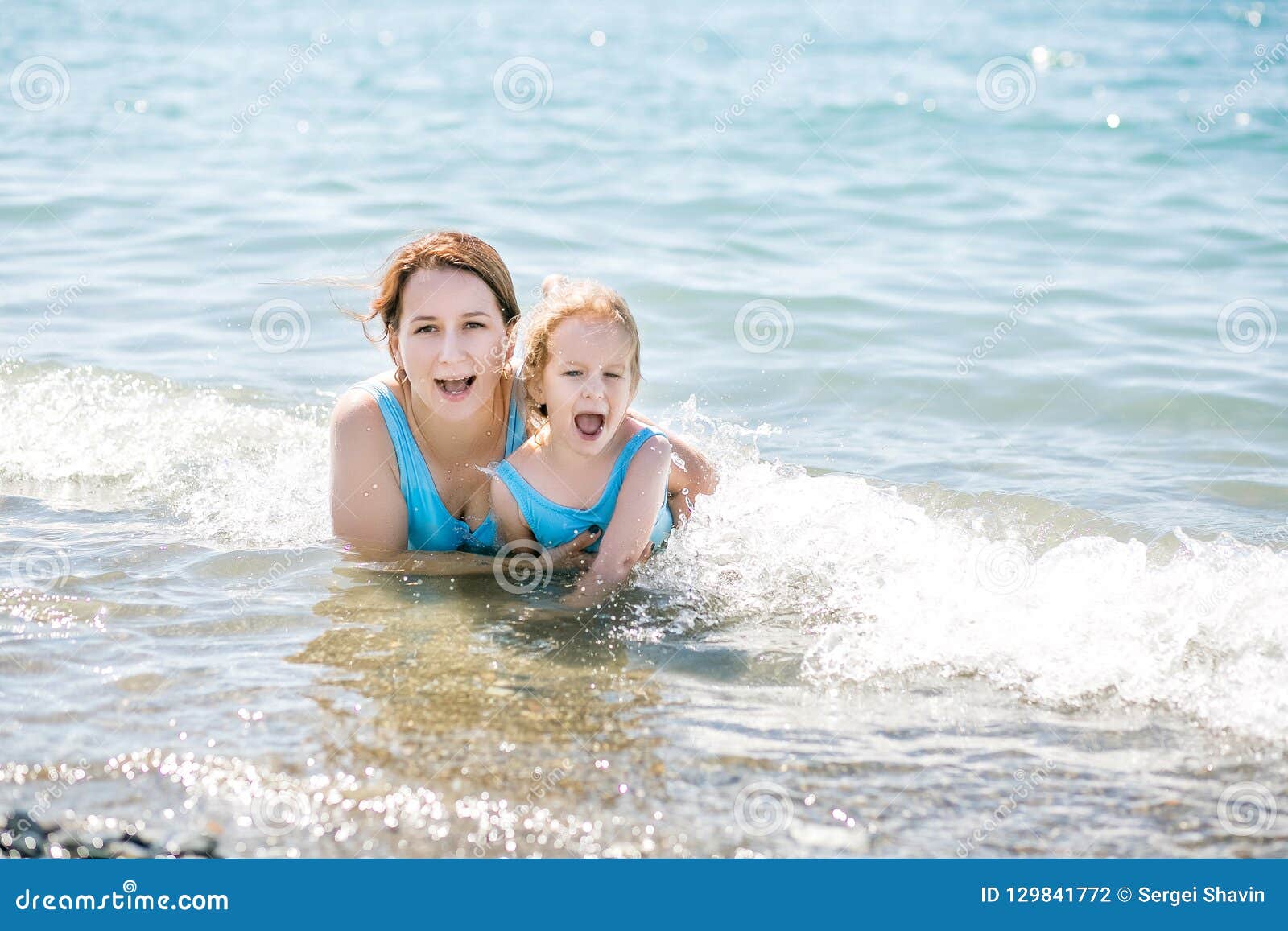 Beautiful Young Mother And Daughter Having Fun Resting On The Sea They 