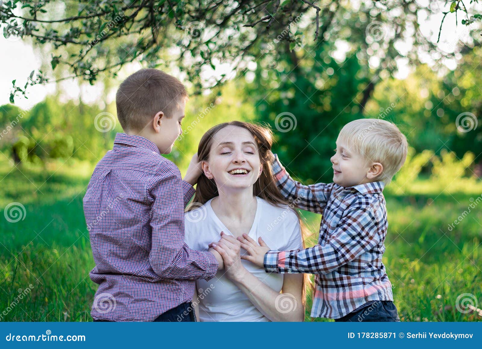 Beautiful Young Mother With Two Sons Children Hug Mom Happy Childhood