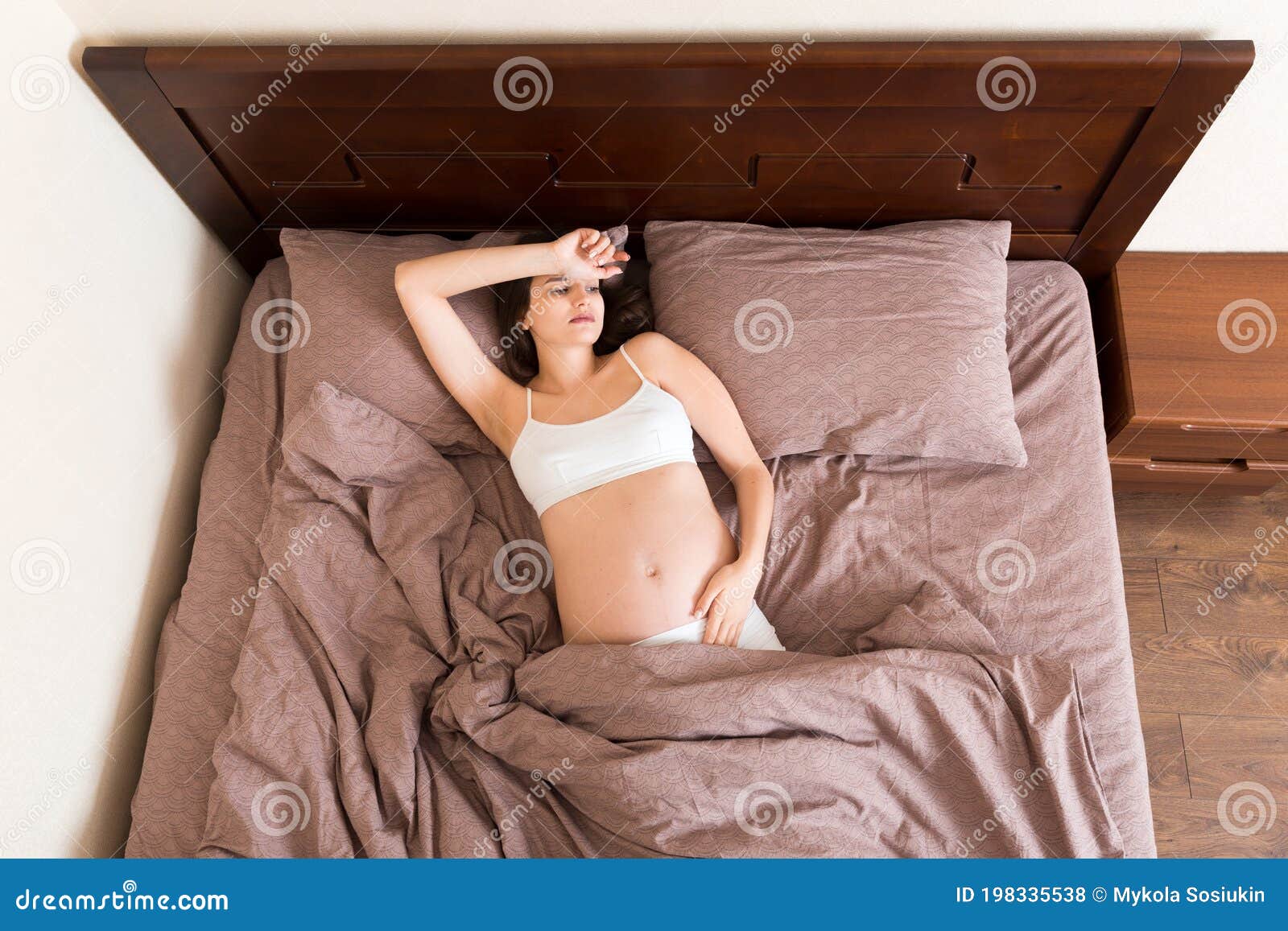 Beautiful Young Pregnant Woman Lying in Bed, Top View. the Girl ...