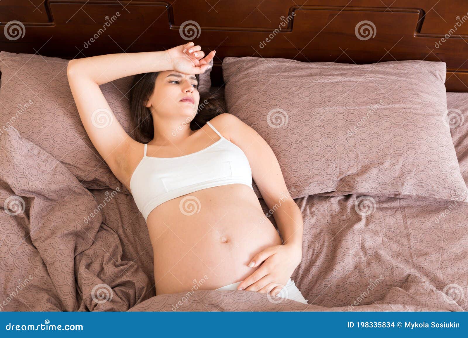 Beautiful Young Pregnant Woman Lying in Bed, Top View. the Girl ...