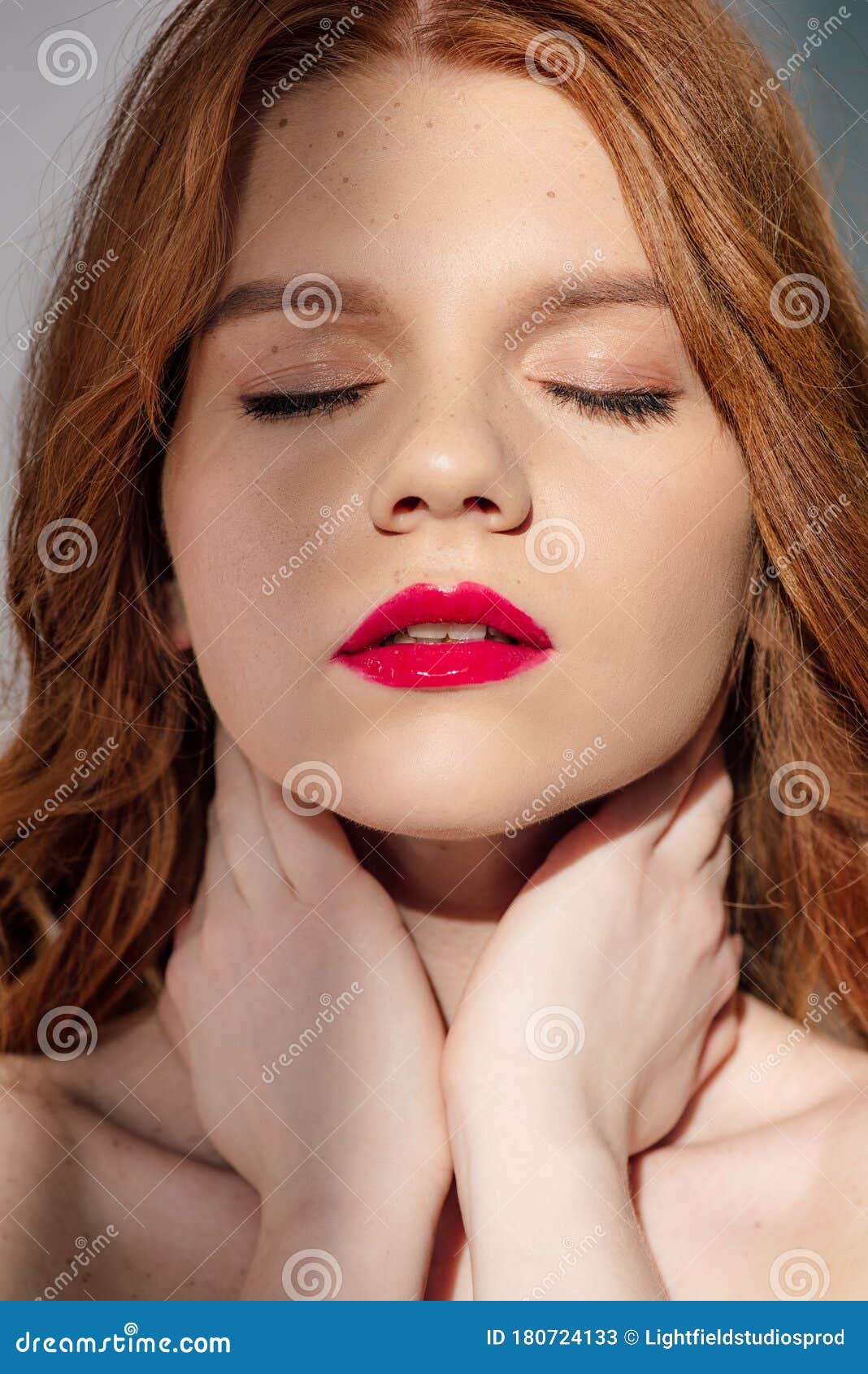 Beautiful Young Seductive Redhead Woman With Red Lips Posing With Eyes