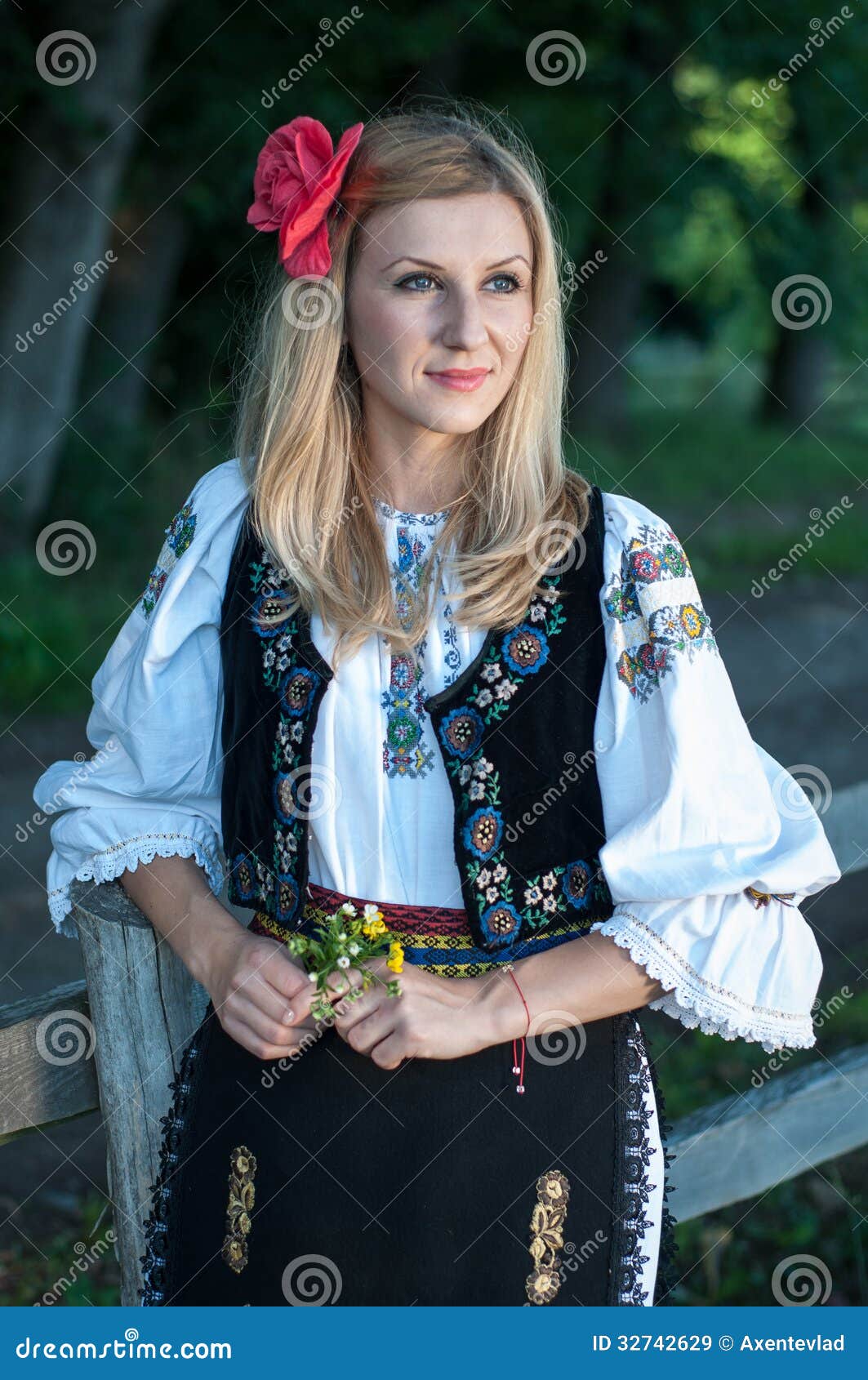Beautiful Young Singer with Flowers Posing in Traditional Costume, Rom ...