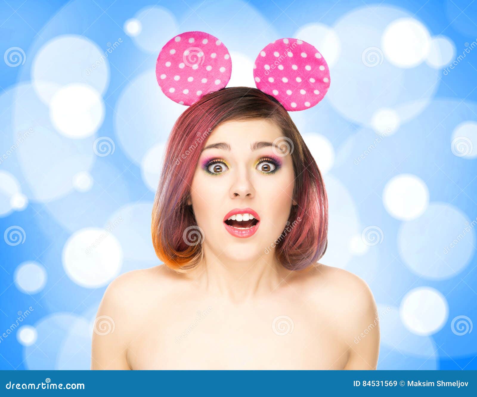 beautiful young smiling woman in mickey mouse ears