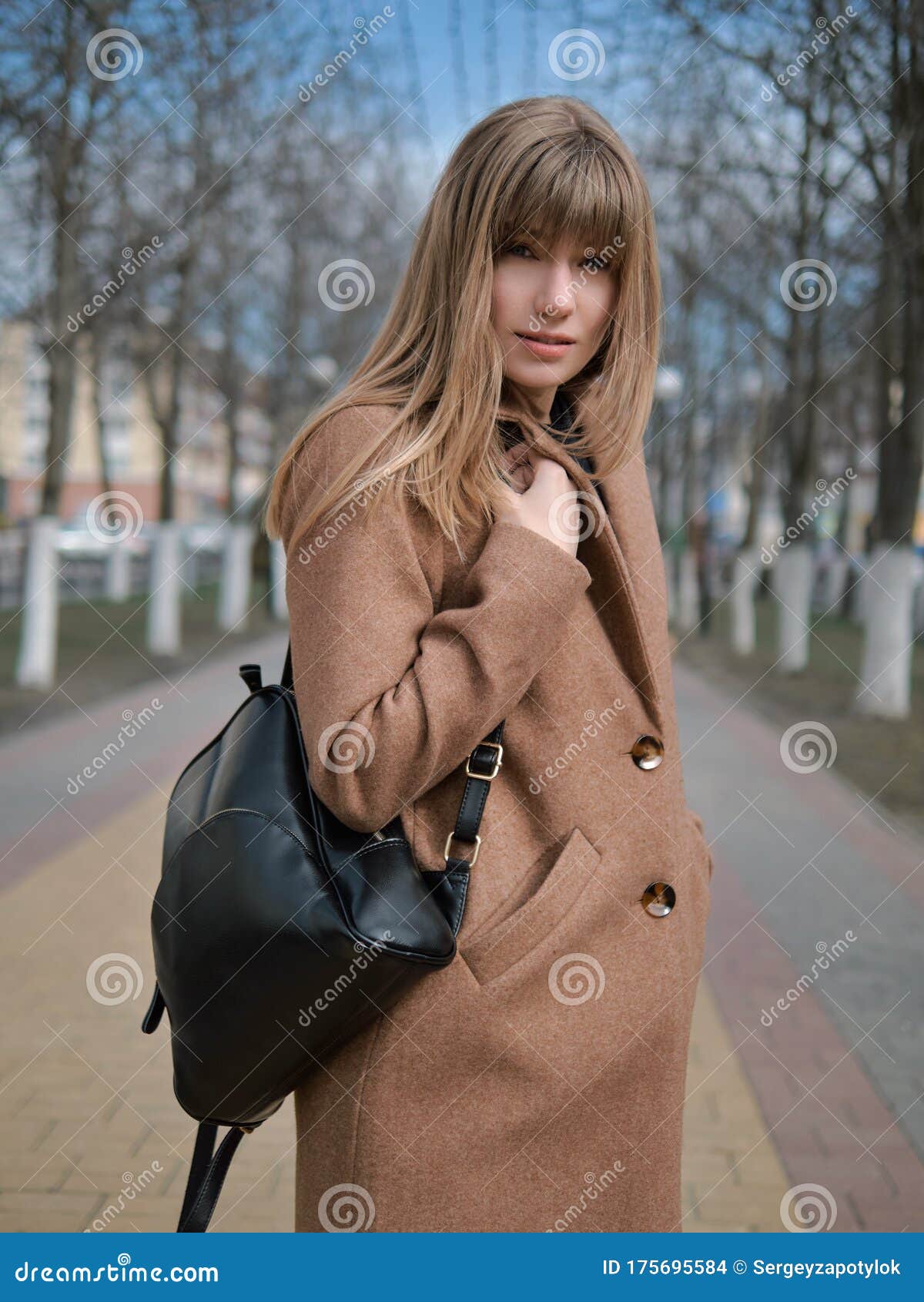 Beautiful Young Stylish Blonde Woman in Trendy Casual Outfit Wearing Beige  Coat and Black Backpack Posing on Spring Weather City Stock Photo - Image  of autumn, beautiful: 175695584