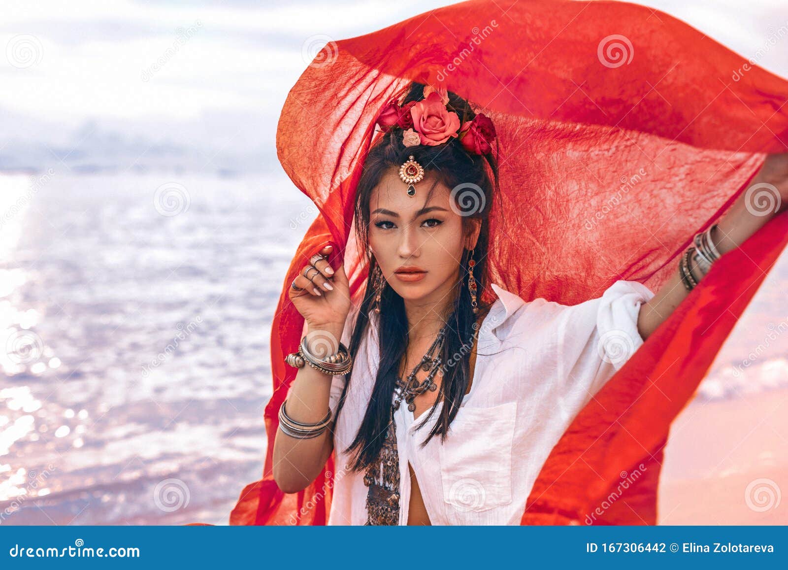 beautiful young stylish woman on the beach at sunset