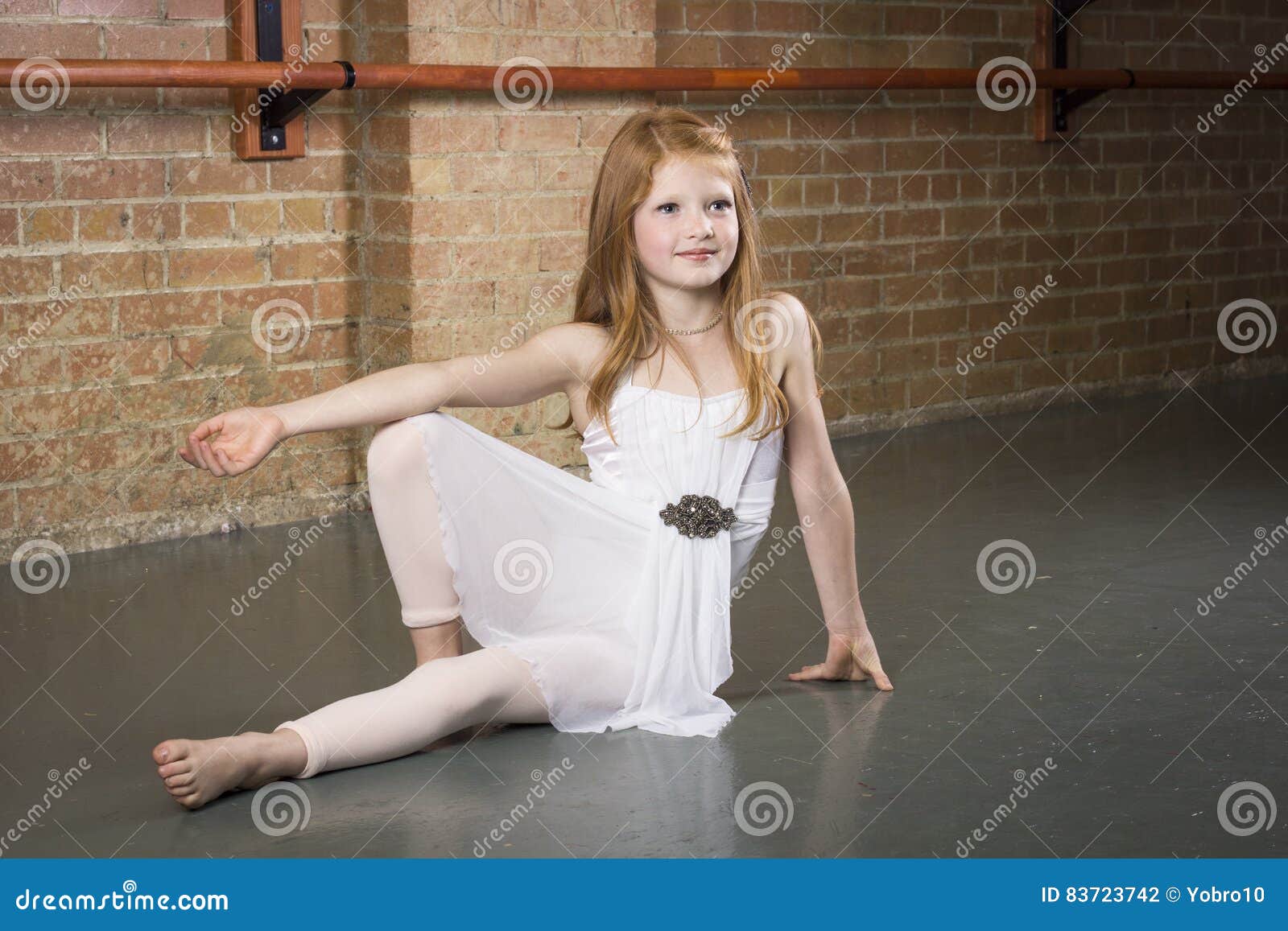 beautiful young and talented dancer posing at a dance studio