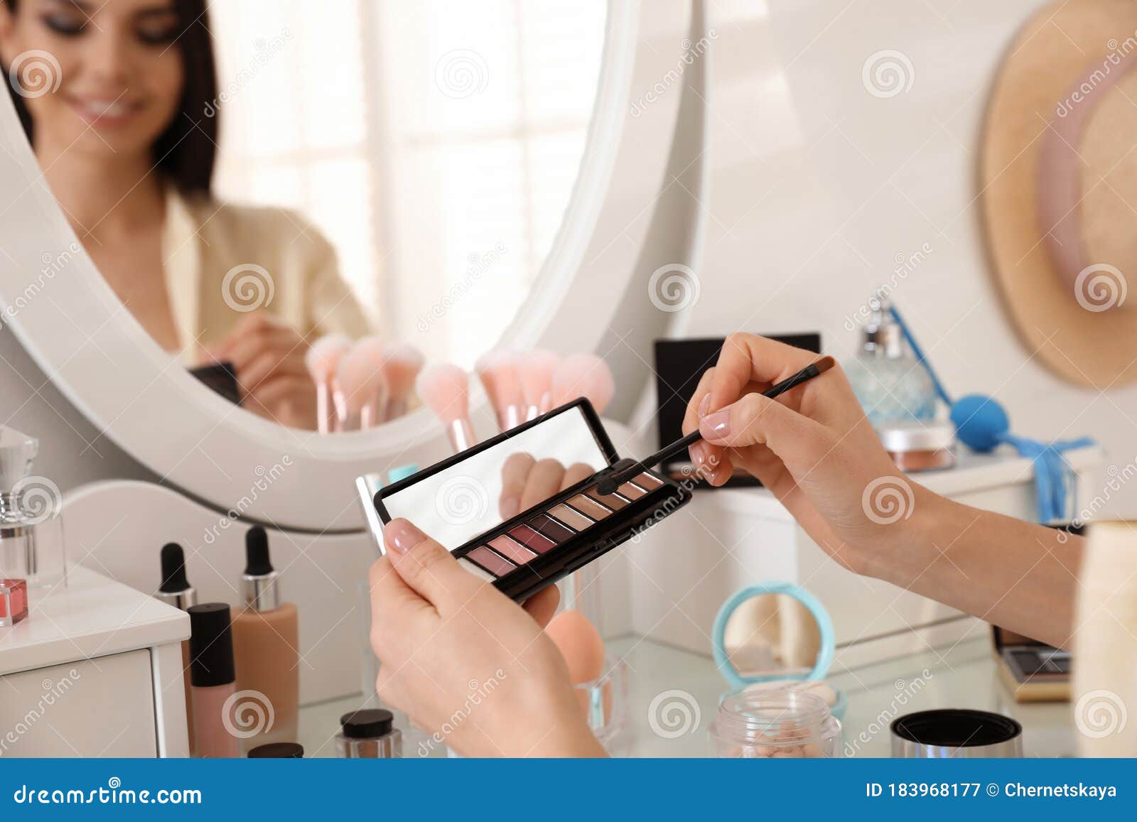 Beautiful Young Woman Applying Makeup Near Mirror, Closeup ...