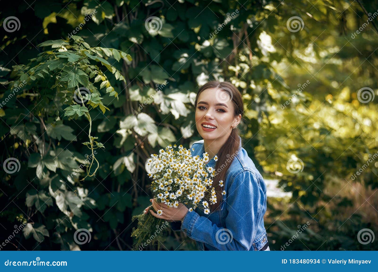 Beautiful Young Woman with a Bouquet of Daisies . Stock Photo - Image ...