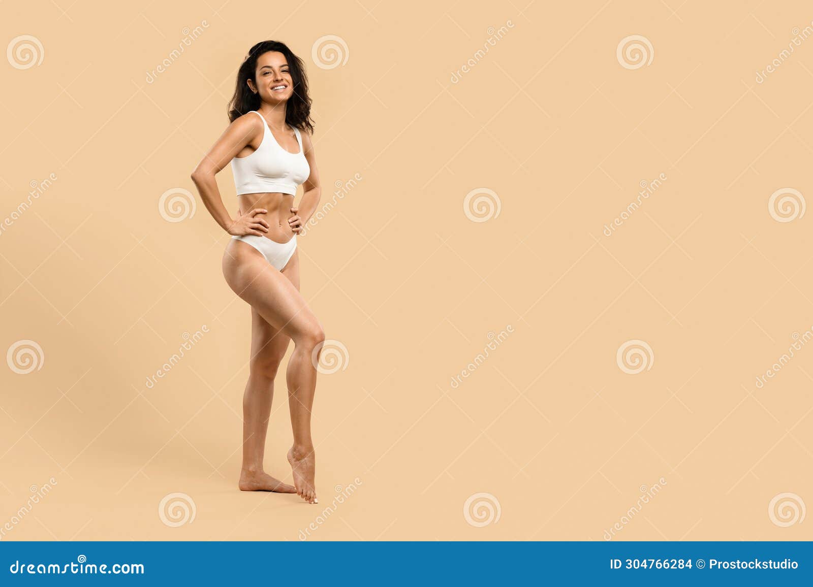 Beautiful Young Woman Demonstrating Her Body Sculpting