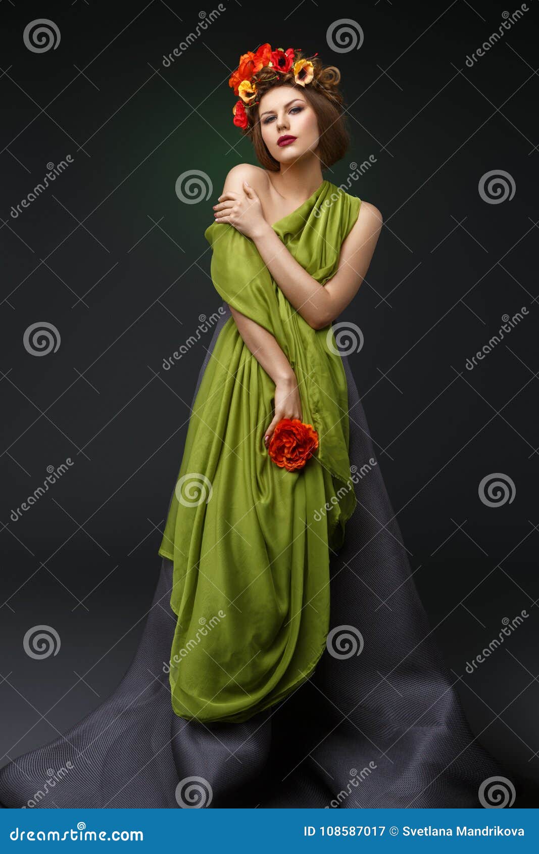 girl in long dress with flowers on head