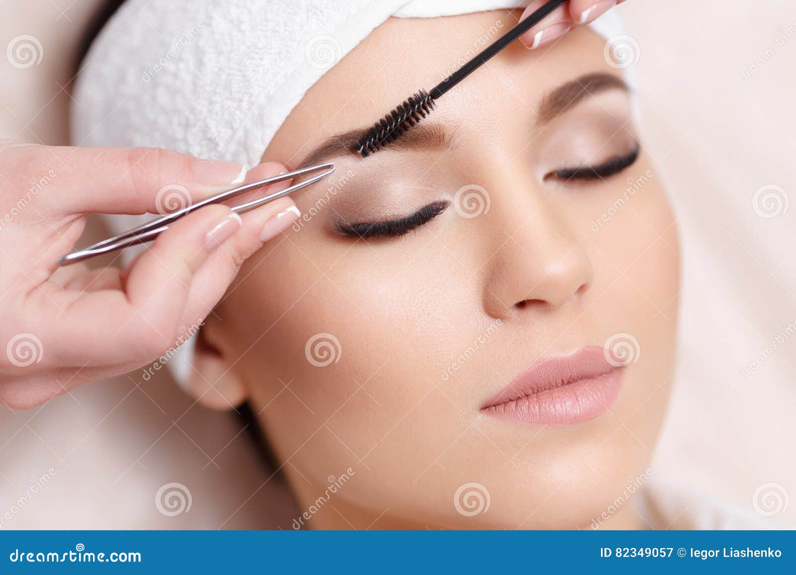 beautiful young woman gets eyebrow correction procedure