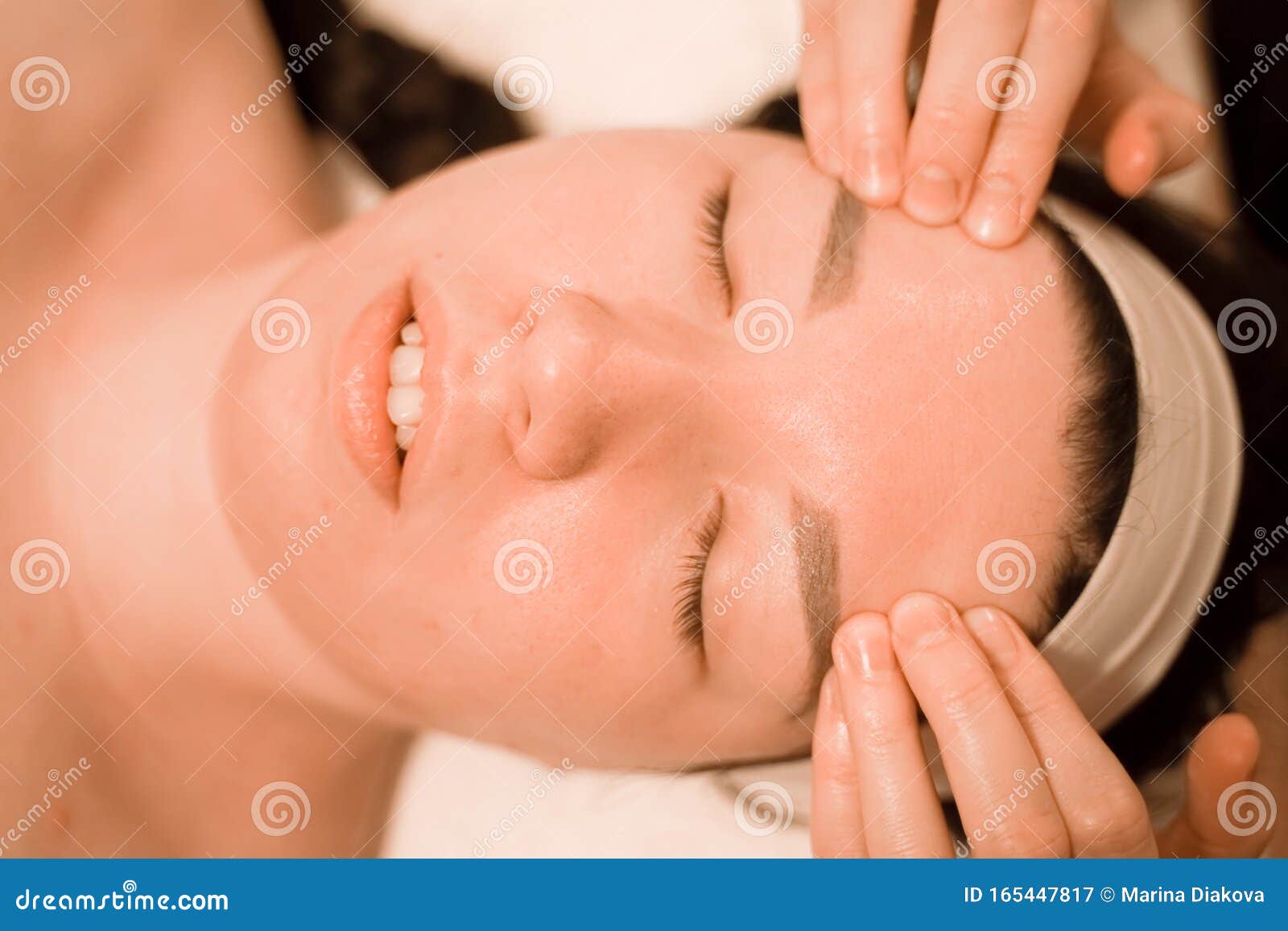 Beautiful Young Woman Getting A Face Massage Treatment At Beauty Salon Stock Image Image Of