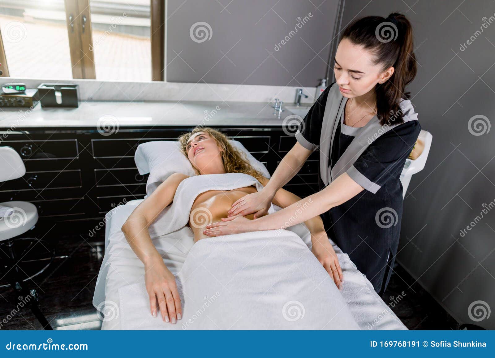 Beautiful Young Woman Having Belly Massage In Modern Medical And 