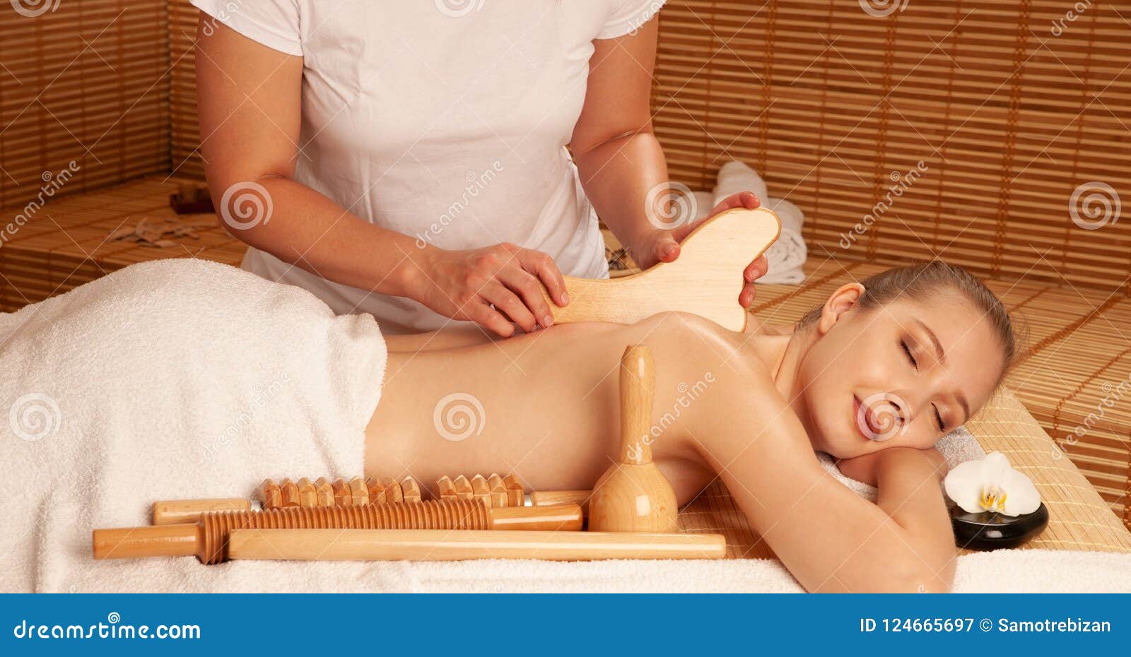 beautiful young woman having a maderotherapy massage treatment