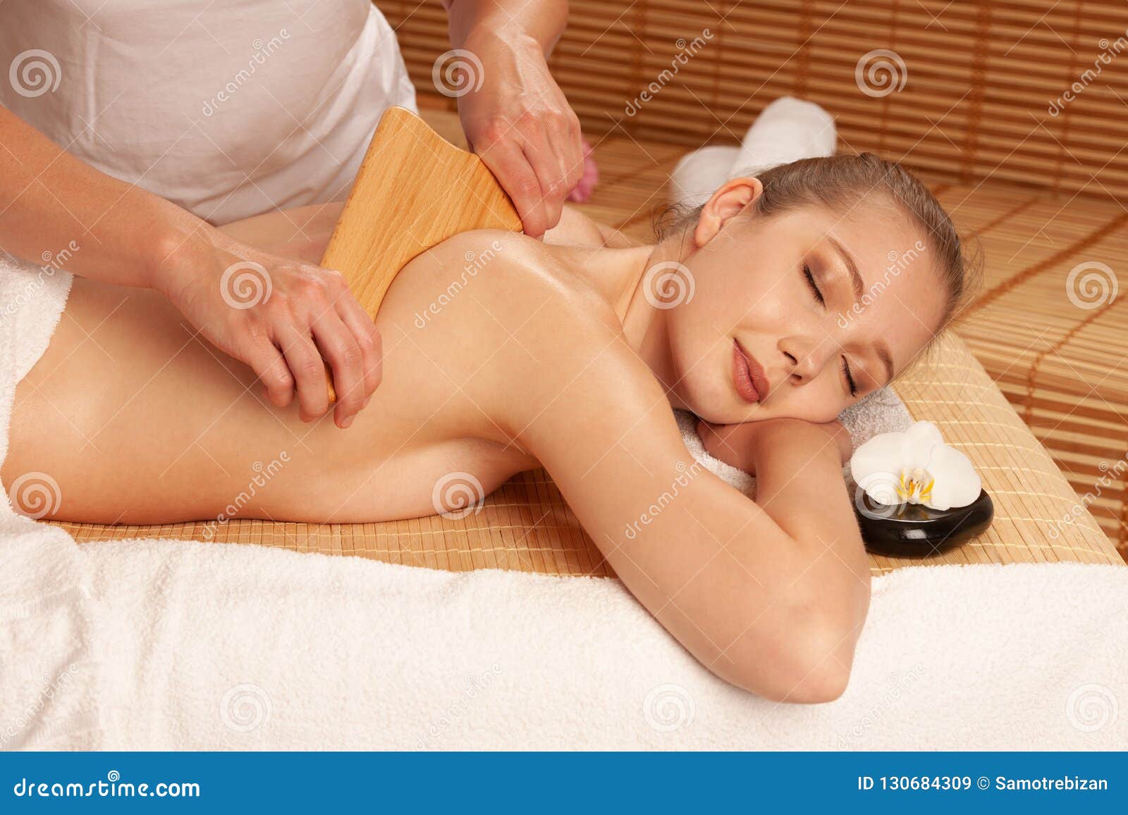 beautiful young woman having a maderotherapy massage treatment